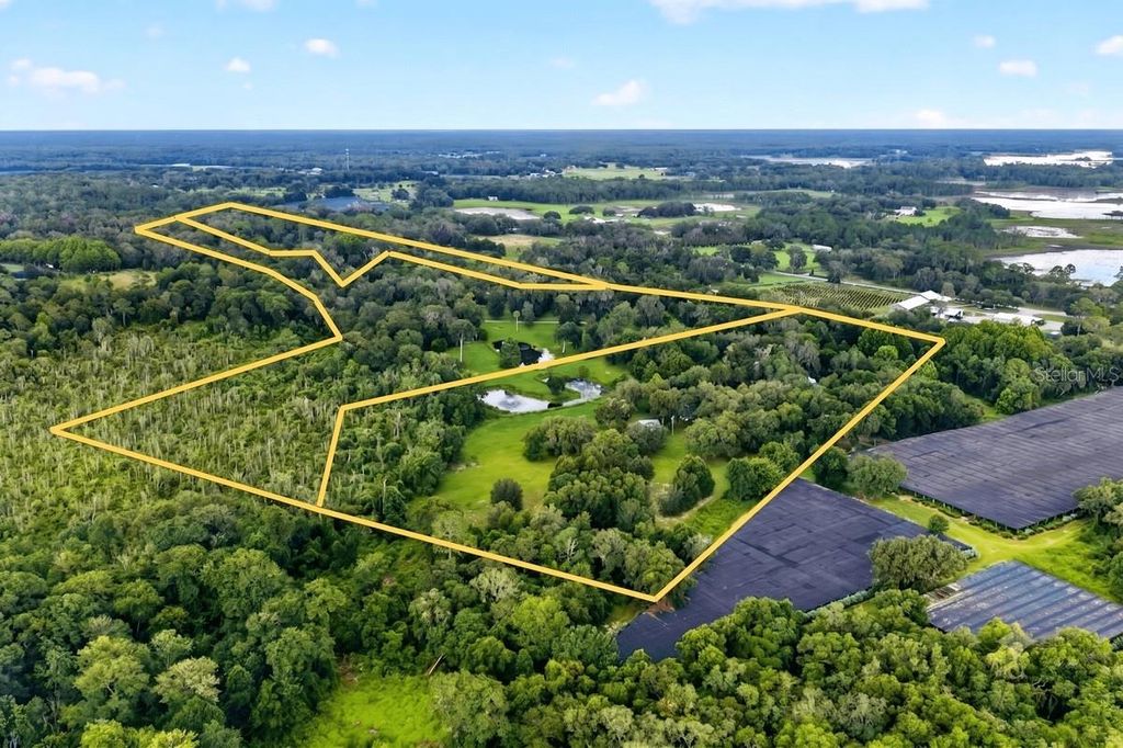 Photo of 1980 Lake Hires Road, De Leon Springs, FL 32130 (MLS # V4950134)
