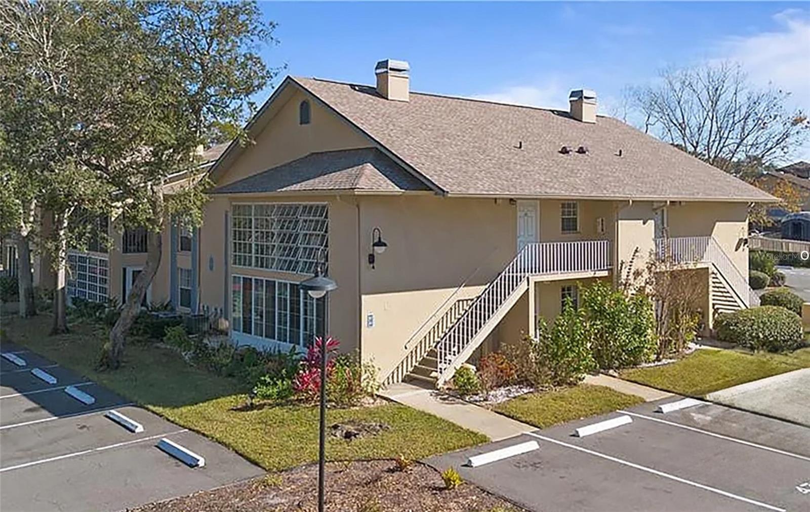 Adorable 2BR/2BA condo in Wellington Station! This 2nd-floor unit features a cozy fireplace, screened porch with windows for great airflow, and a bright, open layout. Conveniently located near shopping, dining, and all that Ormond Beach has to offer—perfect for full-time living or a getaway retreat!