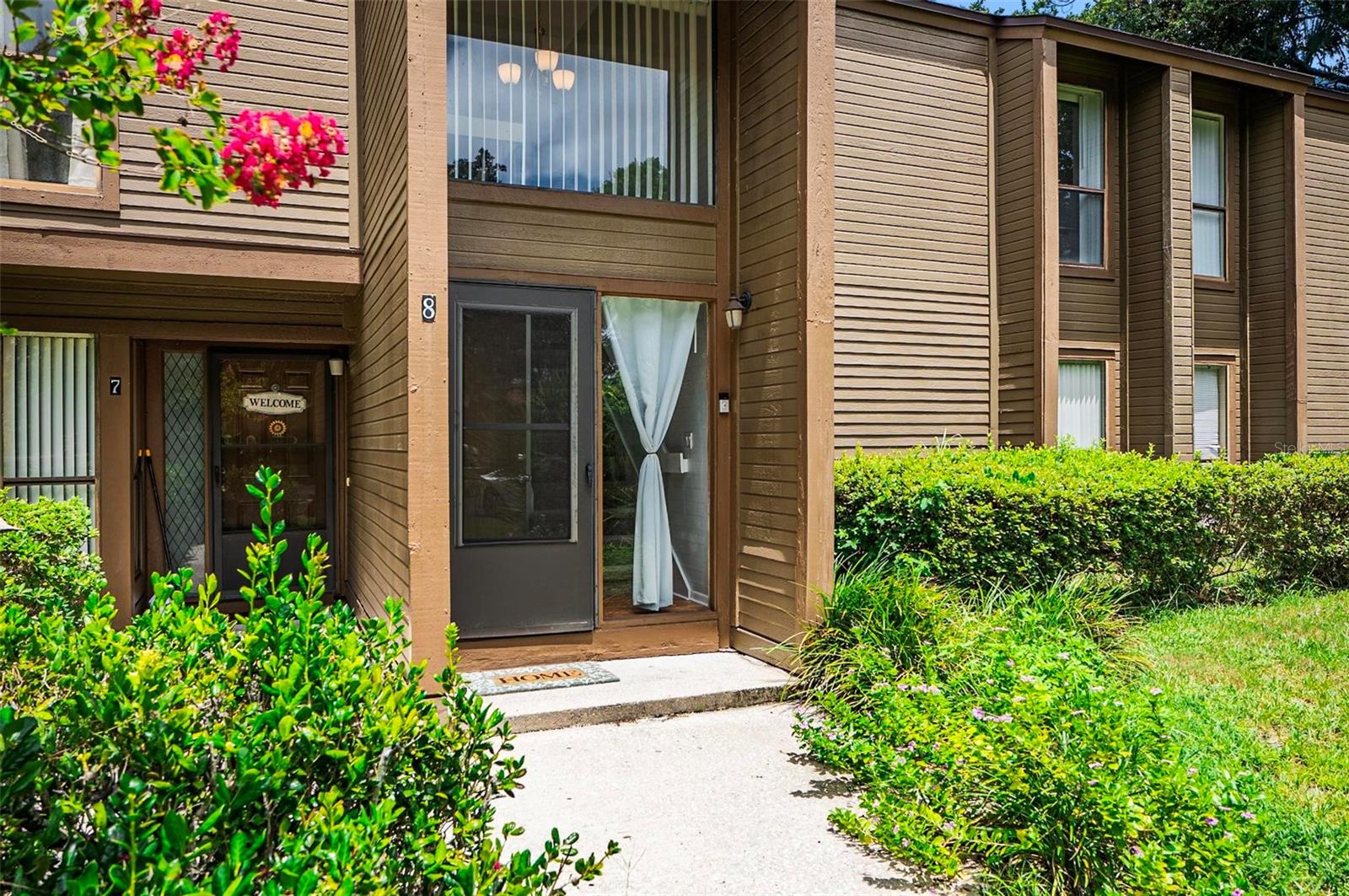 Experience the perfect blend of comfort, convenience, and coastal living in this beautiful 2-bedroom, 2-bath condo in the Woodhaven community of Palm Coast. This second-floor home offers 1,098 sq ft of spacious living, featuring an open layout, a generously sized kitchen with dining space and bar seating, and a massive porch accessed by three sliding glass doors—ideal for morning coffee, reading, or unwinding at the end of the day. Both bathrooms have been tastefully updated, and the condo is clean and move-in ready.
The community is surrounded by lush, mature landscaping and offers resort-style amenities including a year-round outdoor pool, tennis courts, sauna, clubhouse, and fitness center. Located just 4 miles from the beach and near scenic biking/hiking trails, this home also puts you close to shopping, dining, and all that Palm Coast has to offer. Whether you’re seeking a full-time residence or a vacation retreat, this condo delivers peaceful living in a prime location.