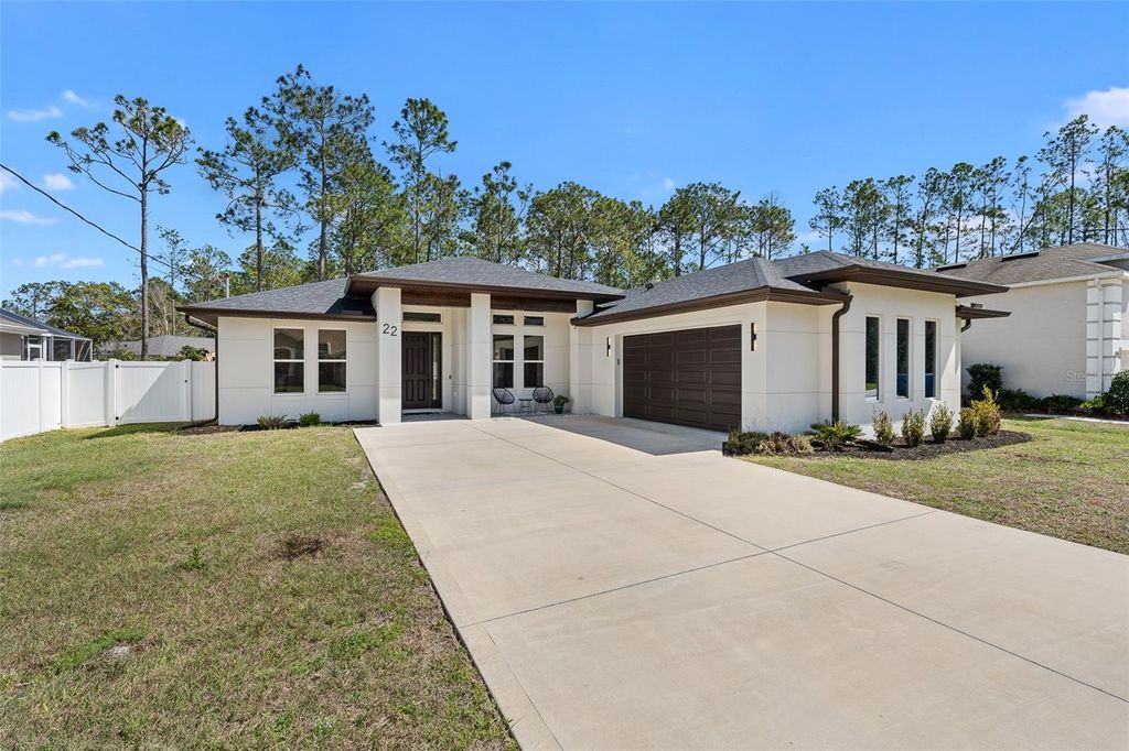 Photo of 22 Zonal Geranium Trail, Palm Coast, FL 32164 (MLS # FC316542)