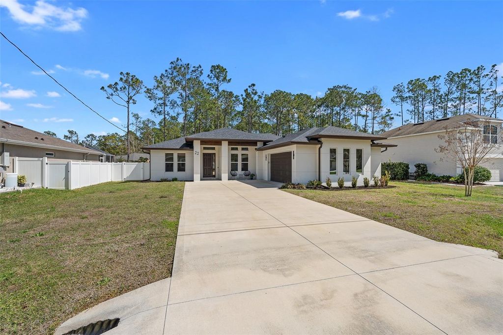 Photo of 22 Zonal Geranium Trail, Palm Coast, FL 32164 (MLS # FC316542)