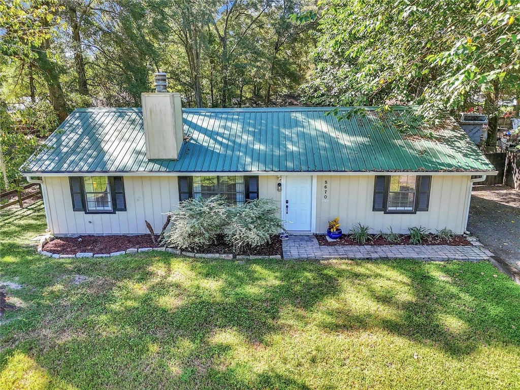Photo of 5670 NW 65th Place, Ocala, FL 34482 (MLS # OM732630)