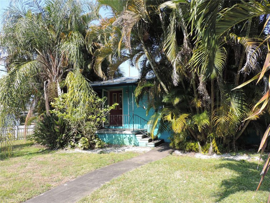 This Mid-century, bungalow style home located in the middle of the city of Gulfport. This two bedroom, one bath (+ and outside 1/2 bath) pool home is located on a corner lot and boast a very lush, mature, tropical landscape. Inside you will find beautiful, original hardwood floors in the living room and both bedrooms, as well as ceramic tile in the kitchen, bathroom, and in the large Florida room located at the rear of the home (that also has a separate home entrance). The kitchen has granite counter tops on the original wood cabinets. This home has a newer metal room that was installed in 2019. The pool was built in 2019 and is surrounded by a concrete cool deck, palm trees, and rocks (in lieu of grass). The carport has been enclosed into a screened-in patio in the rear of the home, where there is also exterior access to the laundry/storage, half bathroom and a separate storage/tool room. This home is being sold "as is" only by the estate
