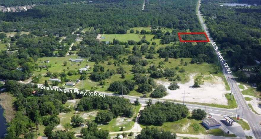 This vacant land tract is located just north of the new Publix-anchored Loughman Crossings Shopping Center (under construction) and is suitable for rezoning for potential Retail/Commercial development. Many new residential subdivisions are currently under construction within a one-mile radius and the nearby Providence Golf & Country Club continues to draw residents from all over the world. FDOT is evaluating the widening of this segment of US Hwy. 17/92, and the Central Florida Expressway Authority is considering this area for the second phase of the I-4/Poinciana Parkway connector.