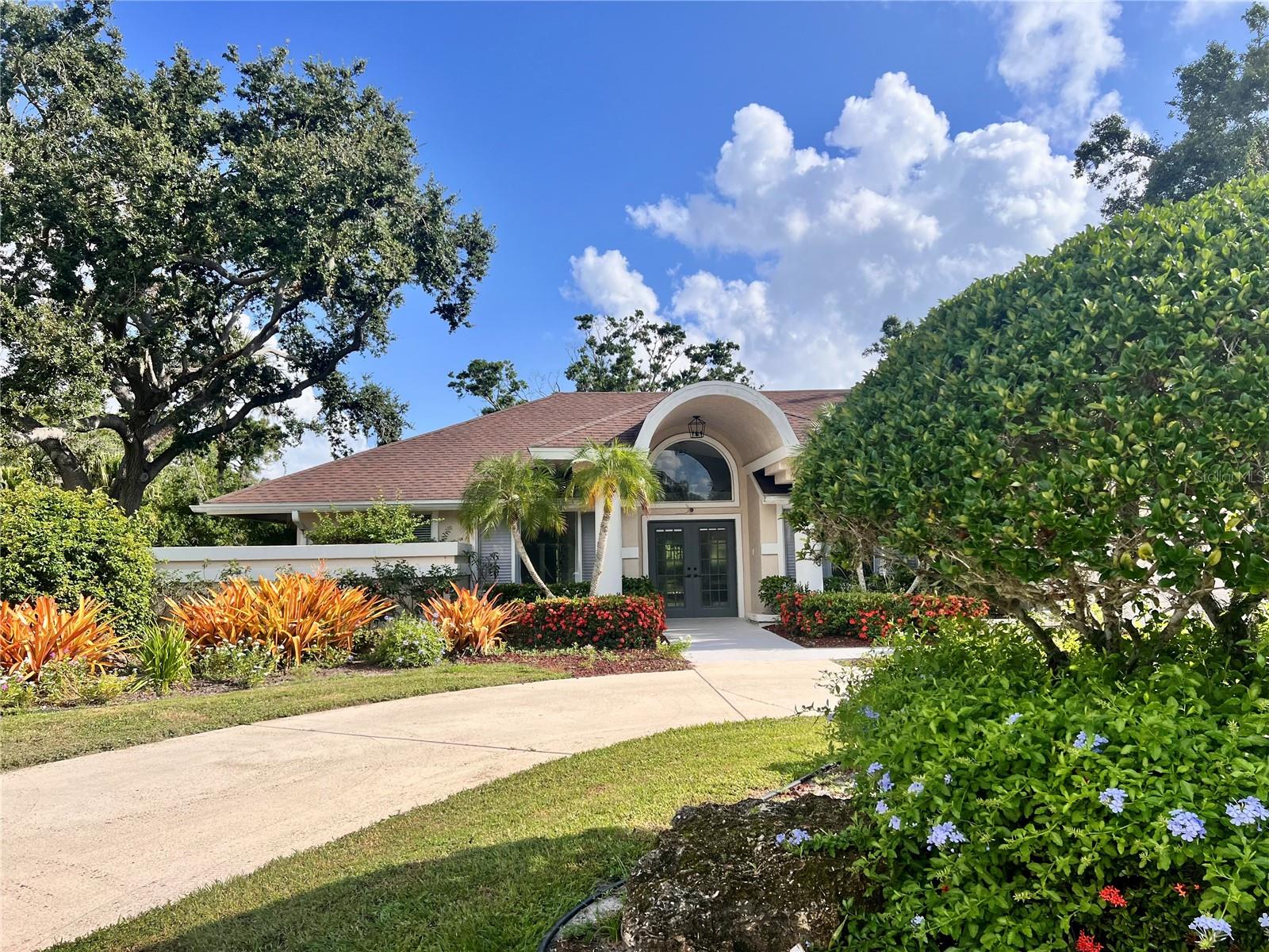Welcome to this spacious 3-bedroom, 3-bath split-plan pool home, perfectly situated on an oversized lot with sweeping lake views visible from nearly every room. Nestled in a serene, tree-lined family neighborhood just minutes from UTC Mall and I-75, this home offers both privacy and convenience in a highly desirable location. Step through the open foyer into a thoughtfully designed layout that includes a formal living room, formal dining room, a separate office, a cozy family room, and an eat-in kitchen—ideal for both everyday living and entertaining. The oversized two-car garage features a built-in workbench, ample storage, and a central vacuum system for added functionality. The primary suite is a true retreat with a beautifully updated en suite bathroom boasting a luxurious whirlpool tub and a separate rain/waterfall shower. Outside, the expansive screened lanai opens to an oversized heated pool overlooking a peaceful greenbelt and large pond—perfect for enjoying Florida’s outdoor lifestyle. Additional features include a private fenced-in area, mature fruit trees, and plenty of space for gardening or recreation. Don’t miss this rare opportunity to own a lakefront home with room to spread out and enjoy the best of Sarasota living.