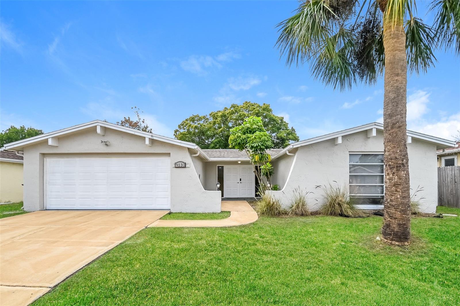 Charm and curb appeal abound for this Port Richey home! Step inside into the inviting foyer and through into the living room, which is positioned at the center of the home. The kitchen boasts chic black appliances, hard surface countertops, and ample storage. Rounding out this ranch style floorplan is the primary suite and two secondary bedrooms. Enjoy your screened patio/in-ground pool all year long! Come ands see for yourself the possibilities that this home has to offer!