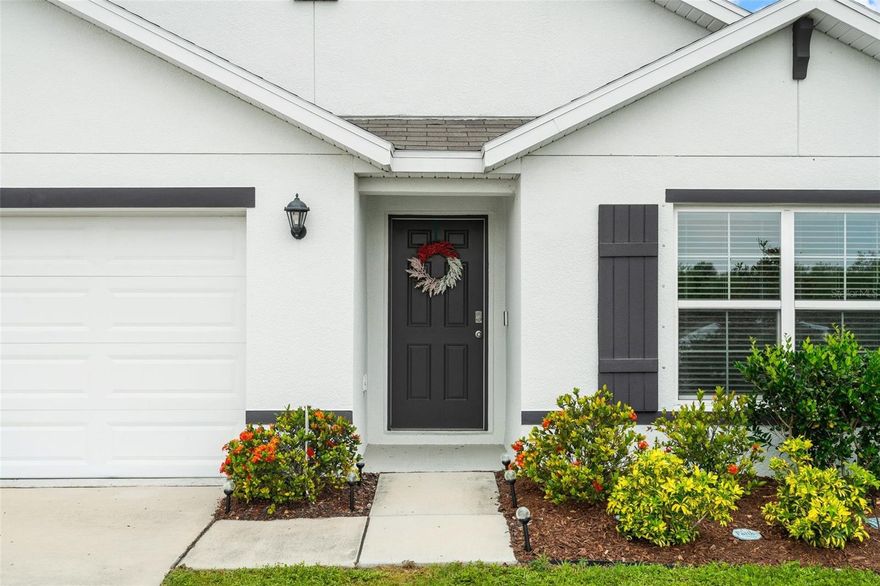 Welcome to Bella Lago, where peaceful Florida living meets everyday convenience in the heart of rapidly growing Parrish. Tucked away in one of Manatee County’s most sought-after areas, Bella Lago offers a quiet neighborhood feel without sacrificing accessibility. Major commuter routes including US-301, Fort Hamer Road, and I-75 are just minutes away making the drive to Lakewood Ranch, Sarasota, St. Petersburg, Tampa, and the Gulf beaches easy and convenient. This well-kept 4-bedroom, 2-bath home offers a smart layout and plenty of extras that make it truly move-in ready. The SPLIT FLOOR PLAN puts two bedrooms and a shared bath toward the front of the home, a third bedroom situated down a separate hallway, and the master suite tucked privately on the OPPOSITE END, complete with a walk-in closet and double sinks. The laundry room and garage access are conveniently located just off the hallway, and yes, the WASHER and DRYER stay. Stainless steel appliances, FRESH INTERIOR PAINT, ceiling fans, and BLINDS throughout, and the real bonus is the POND VIEW. The living space and COVERED REAR LANAI both look out over a peaceful pond, making it a great spot to start your morning or wind down in the evening. FULLY FENCED backyard, EPOXY garage floor, reclaimed water IRRIGATION, a full SECURITY SYSTEM with 2 cameras, doorbell camera and keypad, and a radon detector already in place. The community adds even more value, two pools, fitness center, clubhouse, and playground. And the home sits in a NO FLOOD ZONE, which is always a plus. The surrounding area has something for everyone. Outdoor enthusiasts will love being a short drive from Little Manatee River State Park, known for its scenic hiking trails, canoe launches, horseback riding, and some of the most unspoiled natural Florida beauty in the region. Closer to home, Parrish Community Park offers a great space for families to gather, play, and enjoy the outdoors. Honestly, there’s not much left to do here. Just move in.