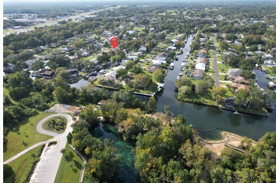This is the perfect home for anyone who loves the water. It is less than 1000ft from 3 Sisters Springs and has excellent access to Kings Bay and the world's oceans. It has its own covered boat house with a lift. Manatees swim her all the time.  The water is fresh and clean.  The home did not flood in either 2023 or 2016. Wide open floorplan.  Live where life is great and commute to work (1 hour to either Ocala or Tampa Airport)