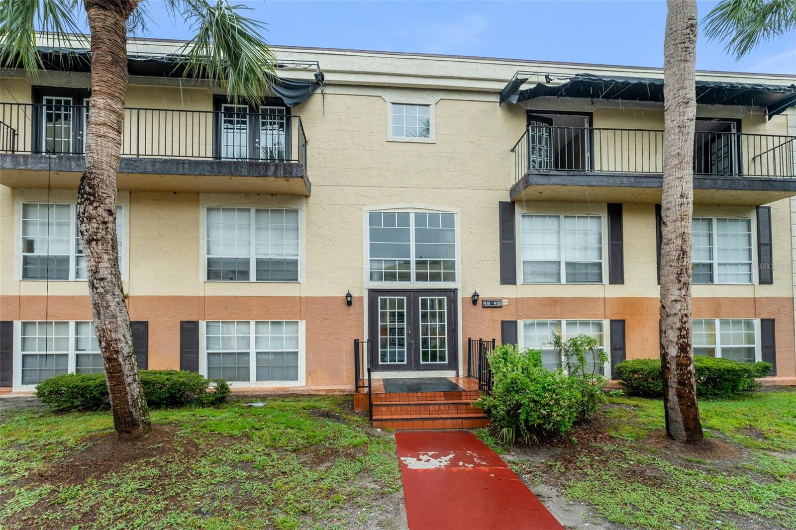**This property qualifies for a closing cost credit up to $1,800 through the Seller’s preferred lender.** Welcome to 4119 Dijon Dr Unit 4119H – a charming and sunlit 2-bedroom, 2-bath condominium nestled on the top floor, offering tranquil pond and greenery views from your very own screened-in balcony. As you step inside, you're immediately welcomed by a bright and airy living room, where a stunning 3-panel sliding glass door draws your eyes outward to the peaceful nature just beyond your balcony. Beautiful laminate flooring flows throughout the home, creating a warm and cohesive feel. To the left, you'll find the formal dining area – a perfect spot for sharing meals and memories – while just across the hall, the kitchen awaits with its classic white appliances and wood-toned cabinetry that lend a cozy, homey touch. Tucked down the hallway between the kitchen and entryway are the two spacious bedrooms. The primary suite is a restful retreat featuring a walk-in closet, private ensuite bath, and elegant French doors that open to your own Juliet balcony – a perfect place to greet the morning light. The second bedroom also features French doors and a Juliet balcony, with the second full bathroom conveniently located just across the hall. As a corner unit on the third floor, this home offers added privacy and exceptional views, along with two assigned parking spaces for your convenience. Whether you're sipping coffee on the balcony or enjoying the breeze through open French doors, this inviting condo is the perfect place to feel at home.