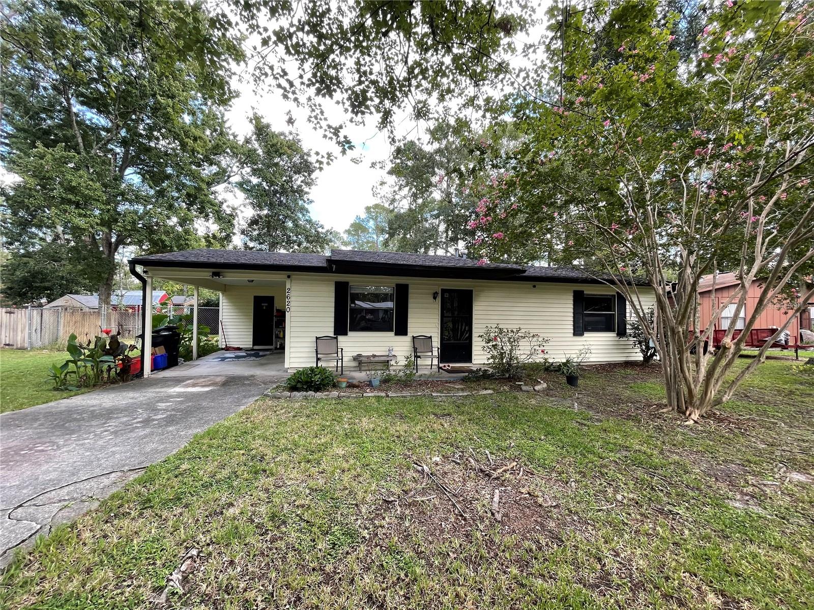 Great way to start in Springtree! Wonderful buy for a home in NW Gainesville. 2 bedrooms 1 bath, new roof in 2024, HVAC in 2020, home has been re-piped, water heater replaced in 2007. Spacious kitchen with gas stove. Great room with vinyl flooring, kitchen with tile. Inside laundry room. Primary bedroom has a walk-in closet. Large fenced back yard with shed and double gate entry perfect for trailer, boat, etc.. NO HOA fees. Close to all kinds of shopping, dining, hospitals, medical offices, Santa Fe college and the University of Florida.