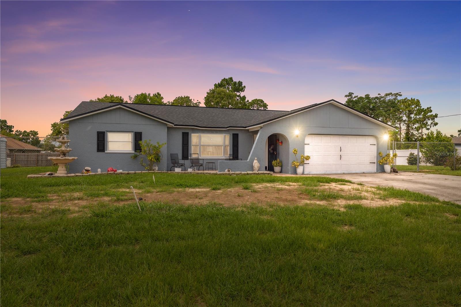 Come experience this beautiful 5-bedroom, 2-bath home situated on a spacious half-acre lot! Enjoy ultimate privacy while relaxing in your custom 12' x 30' pool or soaking in the 5-person jacuzzi. Host gatherings with ease in the large 12' x 60' screened-in patio, complete with a solid cement foundation—perfect for entertaining year-round. This home has been thoughtfully updated to offer peace of mind, featuring a new roof, new A/C system, new septic system, a recently updated water heater, and fresh interior and exterior paint. Additional highlights include a 4-car carport, a fully fenced yard for added security and space, and over 3,000 square feet of total living and entertaining area. Don't miss the chance to own this move-in-ready property that truly has it all!