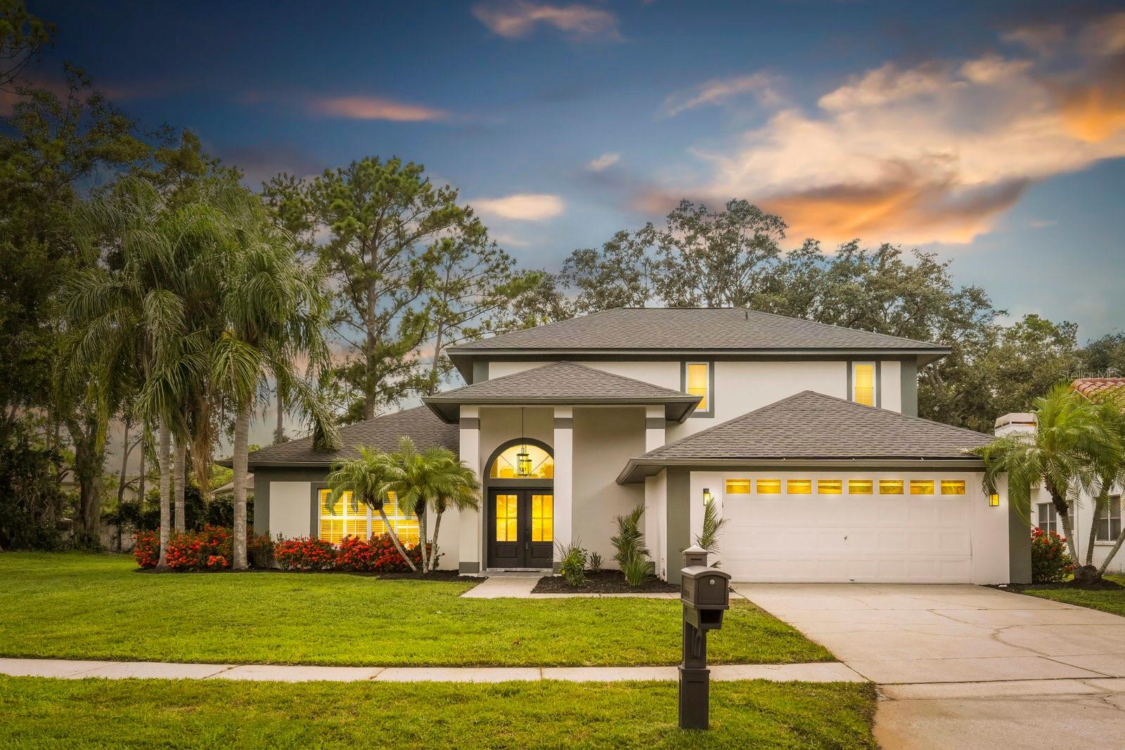 Exquisite Renovated Pool Home in Carrollwood Village – Your Private Corner Lot SANCTUARY Awaits! Welcome to The Village of Stonegate, a premier golf community in the heart of Tampa, where elegance and comfort unite in this fully remodeled two-story stunner. Nestled on a desirable corner lot, this expansive 5-bedroom, 3-bathroom residence offers over 3,100 sq. ft. of thoughtfully crafted living space, ideal for relaxation, entertaining, and everything in between. Step inside and fall in love with the seamless flow from formal living and dining areas to the inviting family room, featuring a cozy wood-burning fireplace and wide-open views of the backyard haven. First-Floor Primary Retreat: The luxurious primary suite provides a tranquil escape with serene pool views, a spacious walk-in closet, and a spa-inspired ensuite featuring dual custom vanities and a walk-in shower. Chef’s Kitchen Perfection: At the heart of the home lies a fully renovated designer kitchen showcasing sleek modern cabinetry, gleaming quartz countertops, stainless steel appliances, designer back-splash, breakfast bar, and eat-in nook with custom Butler's Pantry. Private Home Office: Tucked away with French doors and peaceful views of the lanai and pool, the dedicated office space offers the ideal setting for work or creativity. Throughout the home, new luxury vinyl flooring adds warmth and sophistication, accentuating the seamless design. Room for Everyone: A secondary downstairs bedroom and full bath offer comfort and convenience, while upstairs you'll find three additional spacious bedrooms, a beautifully updated bathroom with dual vanities, and a versatile loft/flex space for play, media, or quiet reading time. Your Personal Resort Awaits: The screened and covered lanai opens to a deep 8- foot pool and heated spa, surrounded by lush landscaping that creates a private, serene atmosphere—perfect for evening swims or weekend entertaining. Community Perks: Enjoy all that Carrollwood Village has to offer—parks, playgrounds, tennis and racquetball courts, scenic sidewalks-all convenient to major roadways, shopping, restaurants--great schools, you have it all!