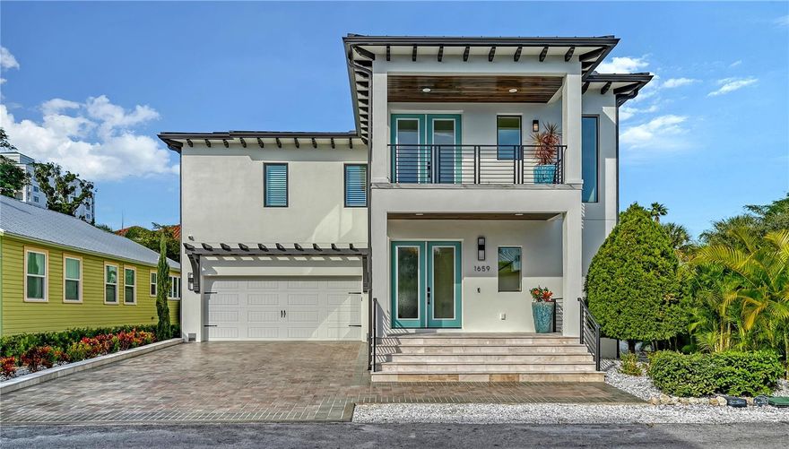 One or more photo(s) has been virtually staged. Welcome to 1659 Devonshire Lane in the heart of Downtown Sarasota's Laurel Park neighborhood. This beautifully designed 2,754 sq. ft. residence completed in 2024  offers four spacious bedrooms and three and a half bathrooms, blending elegance with functionality. The open-concept kitchen and living area are perfect for entertaining and showcase premium stainless steel Thermador appliances, including a gas range with hood and a built-in coffee/tea beverage center for added convenience, additionally a walk-in pantry adds ample storage and the large kitchen island accommodates up to seven, a separate ice maker and two wine coolers that can accommodate over 200 bottles. Step outside to your private oasis featuring a heated saltwater pool enhanced by four fountains, a waterfall feature and colorful lights that enhance the pool at night and a beautiful outdoor kitchen, all set within gracefully textured stucco walls, perfect for entertaining. Enjoy added conveniences such as a full-house Generac backup generator, reverse osmosis water filtration system under the kitchen sink with separate faucet for drinking, and a water softener/filtration system. Constructed entirely of block with cat 5 hurricane windows, stucco exterior and durable metal roof, this home boasts quartz countertops throughout, an irrigation system, and a two-car garage with epoxy flooring. The outdoor spaces are equally impressive, with a marble pool deck on a concrete base, a covered marble front porch, and two balconies—one front and one rear—featuring ceiling fans and porcelain tile flooring. Additional amenities include a half bath off the pool deck and outdoor shower for added convenience.  The primary suite offers a luxurious ensuite bath and a large walk-in closet, creating a serene retreat within this exceptional property.  The two upstairs guest bedrooms are separated by a Jack and Jill bathroom with dual sink vanity and a large walk-in shower with a separate handheld sprayer, bench seating and a window for natural light. The first floor bedroom can be used as office or den with an attached full bathroom with walk-in shower with separate handheld sprayer.  All of this located in the heart of downtown Sarasota just 4 blocks to Main Street and 1 block to Historic Burns Court shops and restaurants. Just one block to Marie Selby Botanical Gardens and a short walk to Bayfront Park and Marina. A two mile drive takes you across the John Ringling Causeway bridge to Lido Beach and St Armands Circle and a short 15 minute drive south takes you to the world famous Siesta Key Beach. This highly sought after convenient location in downtown Sarasota won't last long so book your tour today!! Some photos have been virtually staged.  All measurements are approximate and should not be relied upon as exact.