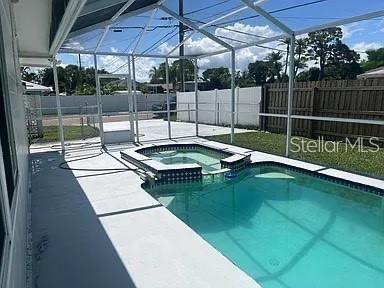 Welcome to your island getaway! This beautiful home in Maximo Mooring offers 1,800 square feet of coastal living, just steps from the water. Recently renovated in 2024, the house blends Key West charm with modern amenities, featuring an open layout, new flooring, and a stylish electric fireplace. The kitchen comes with top-of-the-line stainless steel appliances, perfect for any home chef. The backyard is your private oasis with plenty of space to relax and enjoy the Florida sunshine, along with a pool/spa combo. You'll also have immediate access to the bay and be just minutes from the Gulf of Mexico. Located in the serene waterfront community of Maximo Mooring in St. Petersburg, you'll enjoy easy access to boating, fishing, parks, and more. Plus, you're just a short drive from downtown St. Pete's vibrant cultural and dining scene. This home is available unfurnished, ready for you to make it your own. Required first and security deposit. Don’t miss out on this incredible opportunity for coastal living at its best!