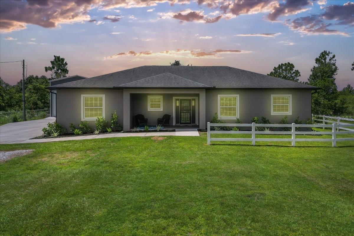 Private Acreage Retreat with RV Garage, Cabana & Versatile Layout!
Set on a fully fenced acre, this beautifully designed 4-bedroom, 3-bath home offers 2,177 sq ft of comfortable living space with room to entertain, unwind, and live your lifestyle-indoors and out.
The spacious kitchen is a showstopper with black stainless steel appliances, a large island with seating, and a direct view into the open-concept living room. Sliding 3-panel pocket doors in the living area lead to an oversized screened lanai, perfect for seamless indoor-outdoor living.
The primary suite is tucked away for privacy and features lanai access, a large walk-in closet, and a spa-like bathroom with granite countertops, a garden tub, generous storage, and a zero-entry walk-in shower.
Bedrooms 2 and 3 share a stylish full bath with another zero-entry shower. Bedroom 4 offers incredible flexibility-it’s large enough for a home theater or pool table and features a bar sink, private bathroom, and its own sliding doors to the lanai. Extra features include crown moulding, a central vacuum system, gutters, and deep closets in the secondary bedrooms.
A spacious laundry room and a 2.5-car garage with golf cart space add even more function to the layout.
Step outside to your backyard oasis-complete with a private cabana featuring a firepit, sink, and electric-perfect for gathering with friends or soaking in the sunset. The 24' x 35' metal RV garage includes 14' and 8' roll-up doors, a storage loft with powered, retractable stairs, and an air-conditioned enclosed room.
This home blends luxury, practicality, and outdoor living...all on your own peaceful acre. A-rated schools nearby, parks, trails, and preserves, all within 30 minutes the beaches and Orlando's main attractions!