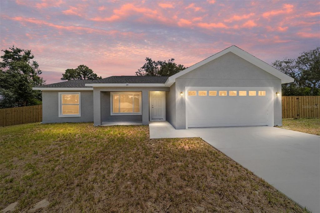 Photo of 114 Malauka Loop, Ocklawaha, FL 32179 (MLS # OM706849)