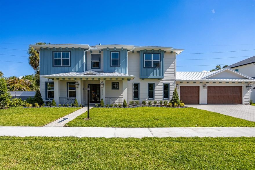 Under contract-accepting backup offers. Stunning new construction by MOMENTUM HOMES in the heart of sought-after Virginia Park! This exceptional 4-bedroom, 4.5-bath residence offers 4,253 SF of thoughtfully designed living space with designer-selected finishes throughout. The gourmet kitchen features a full Thermador appliance suite including a 48" gas cooktop, 48" panel-ready refrigerator, and 30" wall oven, complemented by Wellborn cabinetry with 42" uppers to the ceiling, quartz countertops, a spacious island, and under-cabinet LED lighting. Hardwood floors flow throughout the main living areas, while 10-foot ceilings and faux wood beams create a grand yet inviting atmosphere. The primary suite boasts a spa-inspired bath with dual shower heads, freestanding tub with floor-mount faucet, and floating vanity. Additional highlights include a private study with wood beams, dedicated media room, walk-in pantry, mudroom, and custom closets throughout. Step outside to your private oasis featuring a heated pool and spa with mini pebble finish, natural stone deck, and a fully equipped outdoor kitchen with Summerset grill and granite counters. The 3-car garage includes epoxy floors and EV charger pre-wire. Impact windows and doors throughout, two-zone 16 SEER HVAC, natural gas vented fireplace, generator pre-wire, landscape lighting, and smart-home wiring complete this extraordinary home. Welcome home to 4017 W Palmira!