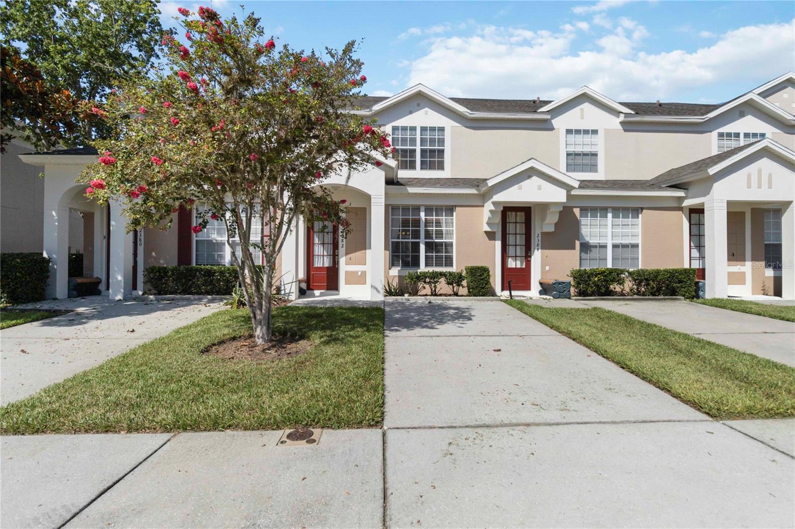 Discover this fantastic 3-bedroom, 3-bathroom townhouse nestled within the secure, gated Windsor Palms Resort community. This home offers the perfect blend of comfort and convenience, with an open floorplan and tile flooring throughout the main living areas. Enjoy the ease of a first-floor bedroom with an ensuite bathroom, providing flexibility and privacy. Step out onto your private screened patio and take in the serene wooded conservation views. Upstairs, you'll find two additional spacious bedrooms, both with walk in closets and their own attached bathrooms. Bedrooms are comfortably carpeted. Windsor Palms is more than just a community; it's a lifestyle! Residents and guests have access to an impressive array of resort-style amenities, including a sparkling pool, splash pad, playground, tennis and basketball courts, beach volleyball, an arcade, fitness center, a convenient sundries shop and more. Located with easy access to all of Orlando's world-class theme parks, shopping, dining, and more, this townhouse is mostly turnkey and ready for you! "Bundled service pricing available for buyers. Connect with the listing agent for details." Don't miss out – be sure to check out the video tour!