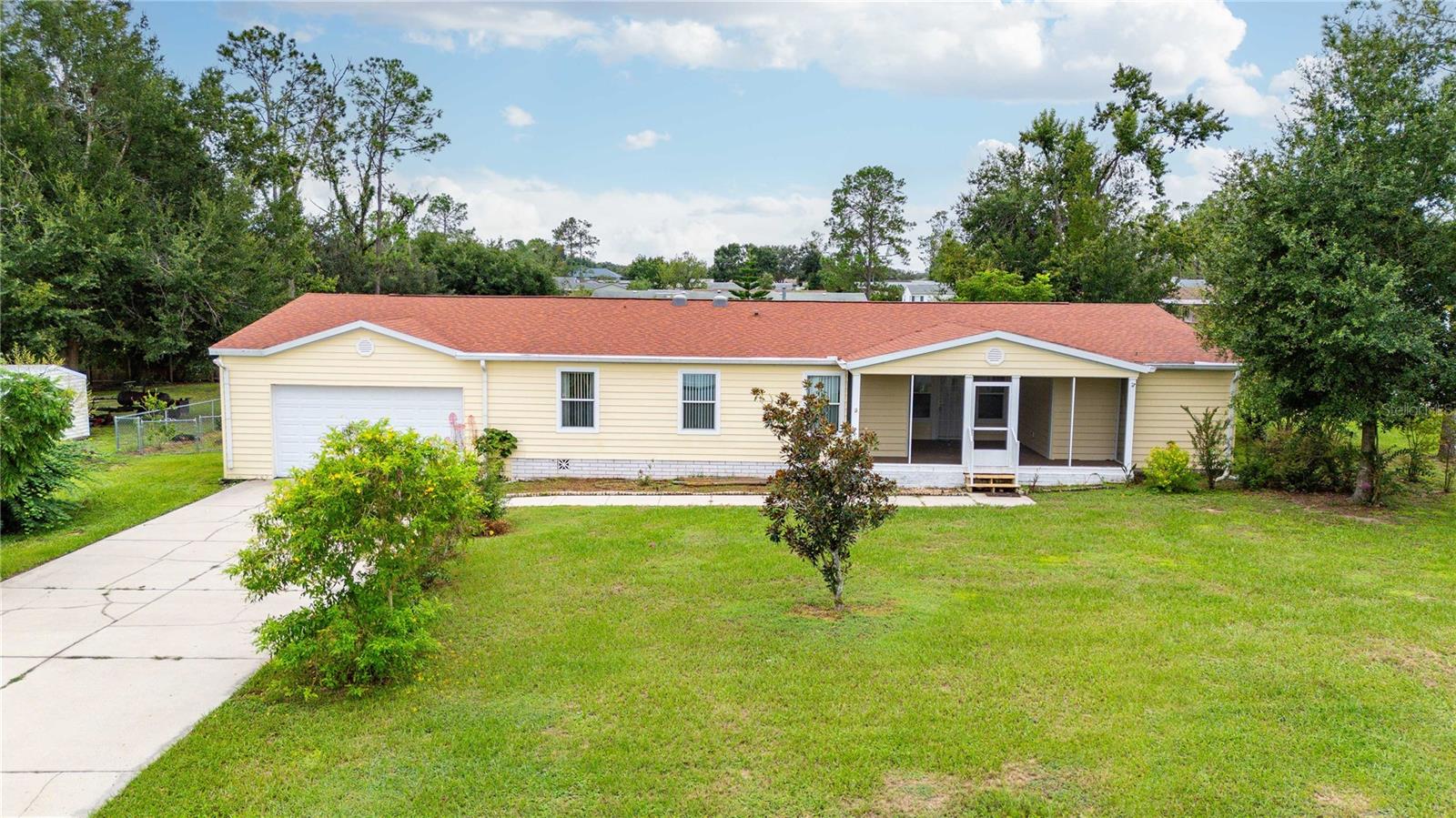 Come check out this Beautiful 3-bedroom 3 bath manufactured home in the desirable neighborhood of The Pines conveniently located on the outskirts of Dade City tucked away. The Palm Harbor model features a split bedroom floor plan, full tape and textured walls, tile in the kitchen and bathrooms, laminate flooring in the remainder of the home and has a bonus den/office and is situated on a generous half acre (MOL). fully fenced back yard, screen enclosed front and back porches. The seller installed solar so your electric bill will be minimal (sellers current bills are approx. $35.00 a month) and as an added bonus the whole house Generac generator will ensure you are never without power. The oversized 4 CAR garage with cabinet storage and workbenches. Roof & AC are new. Generac is approx. 3 years old, solar approx. 2 years old. Come check out this highly sought after neighborhood.