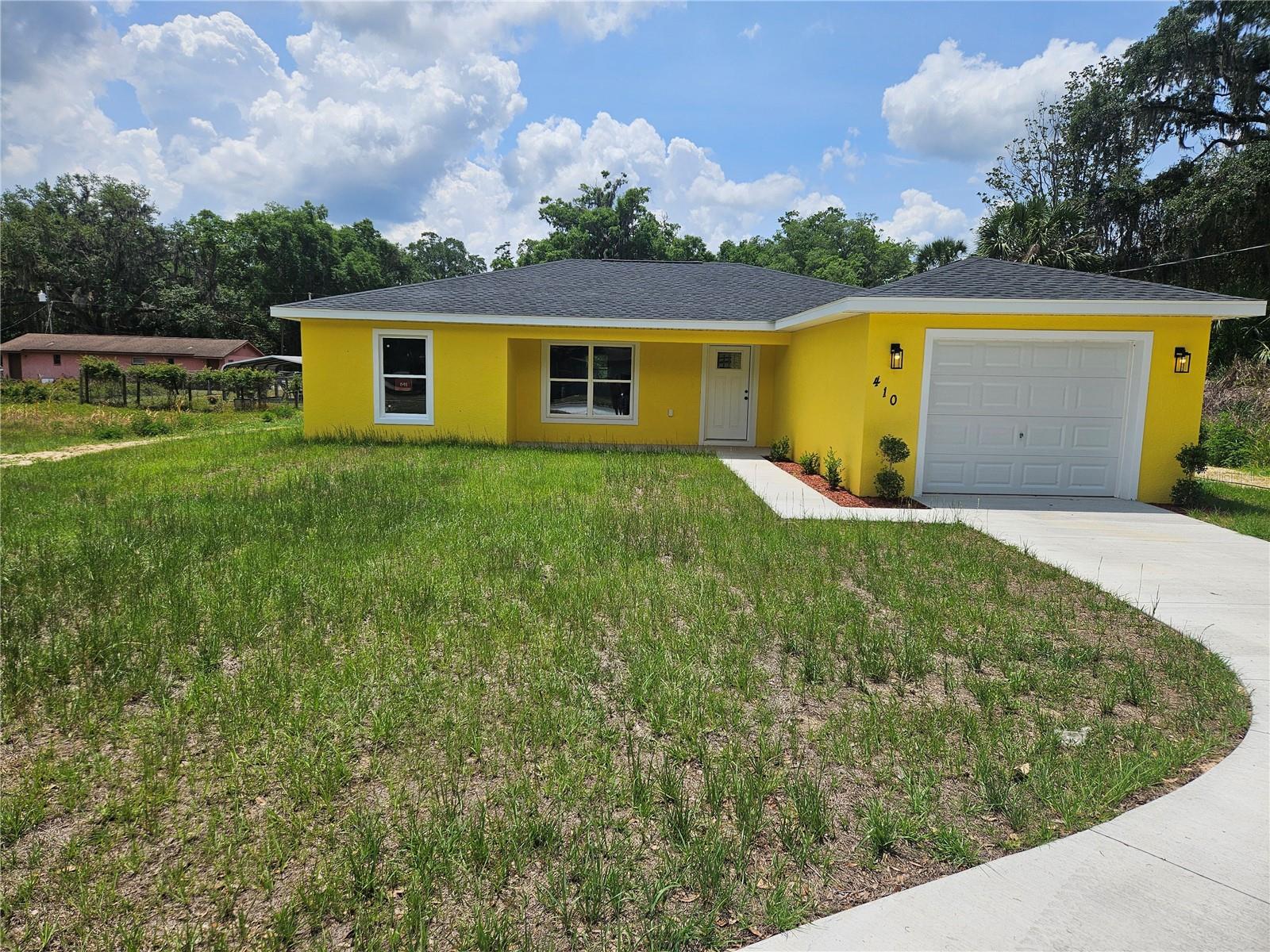 This newly built custom home built in 2024 comes with a stainless steel refrigerator, Range, Microwave, and dishwasher! The kitchen also features granite counter tops and a spacious island. This home has a cozy dining room with a view to the back yard through the sliding glass doors. The master bathroom also features your walk in closet.