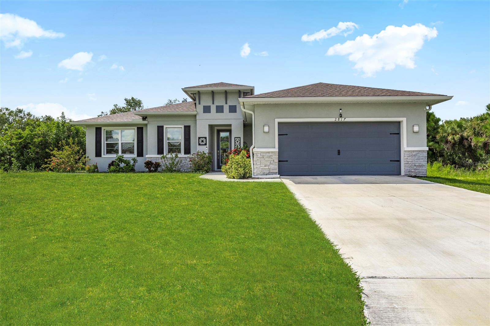 Enjoy the best of Florida living in this 2022-built 3 bedroom, 2 bathroom, plus den, pool home, featuring fully owned solar panels that provide long-term energy savings and efficiency. Designed with both comfort and lifestyle in mind, this home offers a seamless blend of modern finishes inside and an exceptional private retreat outside. The highlight of the property is the expansive screened-in lanai, where a sparkling heated pool and generous deck create the perfect setting for year-round enjoyment. Whether you’re relaxing in the sun, entertaining guests, or dining outdoors, the lush greenery and canal backdrop offer unmatched privacy and tranquility. Inside, the open-concept design welcomes you with wood-look tile flooring, a bright kitchen with a large island and stainless-steel appliances, and a versatile den ideal for an office or hobby space. The primary suite features dual vanities, a walk-in shower, and a spacious closet, while two additional bedrooms provide comfort for family and visitors. With no HOA restrictions, you’ll enjoy flexibility and freedom while still being just minutes from North Port’s parks, trails, waterways, and the vibrant Wellen Park area with shopping, dining, and CoolToday Park. World-class Gulf beaches are also within easy reach, making this home a complete package of convenience, lifestyle, and value. **THIS PROPERTY QUALIFIES FOR A 1% LENDER INCENTIVE IF USING PREFERRED LENDER. INQUIRE FOR MORE DETAILS.**