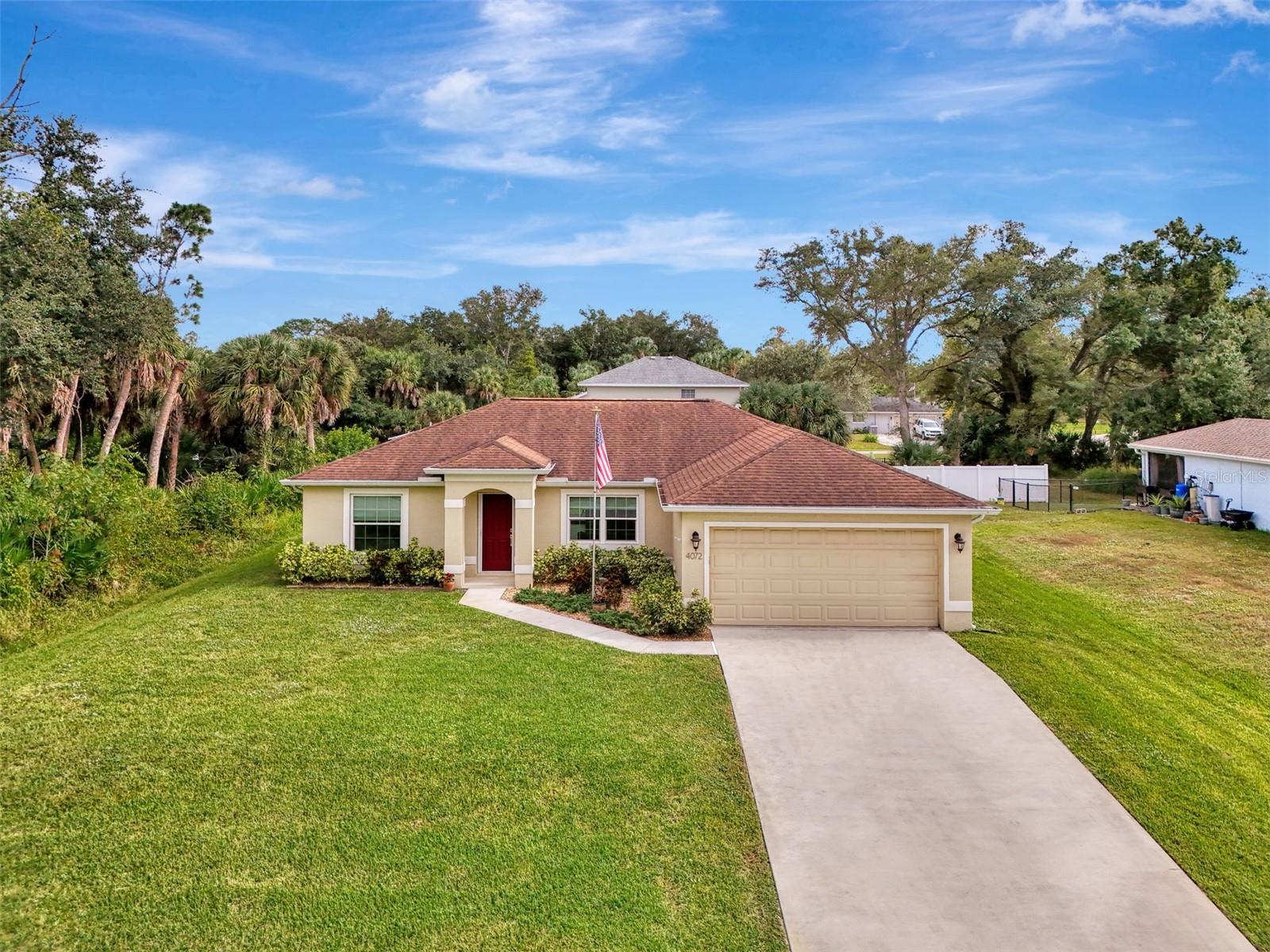 Stop Looking — This North Port Gem Has It All! Built in "2018" and filled with upgrades from top to bottom, this beautifully maintained split-plan home is a rare find in one of North Port’s most desirable neighborhoods. With 3 bedrooms, 2 full bathrooms, and a 2-car garage, every inch of this home was designed with style, comfort, and convenience in mind. Step inside and feel the quality right away. Large tile flooring flows throughout the home, giving it a sleek, modern look that’s also easy to maintain. The impact windows and doors add peace of mind while keeping the home quiet and energy-efficient. The kitchen is a true showpiece—perfect for anyone who loves to cook or entertain. Enjoy a propane gas stove, stainless steel appliances, and a granite countertop center island that’s both functional and eye-catching. Beautiful wood cabinetry with soft-close doors and pull-out drawers make storage easy, while the glass tile backsplash and upgraded lighting—including recessed, pendant, and a modern chandelier—add a designer touch. The master suite offers a relaxing retreat with custom blinds, a ceiling fan/light, and a spacious layout. The master bath shines with dual granite-topped sinks, a walk-in shower featuring a granite seat, decorative tile design, and modern chrome fixtures. Both guest bedrooms are bright and inviting, complete with French windows, custom blinds, and tile flooring throughout. Laundry is a breeze with the full-size washer and dryer, built-in cabinetry, and a wet sink with shelving. Step through the back sliding glass doors—complete with accordion blinds—to a 10x16 covered lanai, the perfect spot to enjoy the Florida sunshine year-round. A white vinyl privacy fence from the neighboring property ensures a peaceful outdoor experience. Additional upgrades include a water softener, peroxide injection water system, 20-lb propane tank for cooking, and regular pest control service. Best of all, this home is not in a flood zone! Located just minutes from shopping, restaurants, the Atlanta Braves spring training stadium, Wellen Park, and the new Sarasota Memorial Hospital, with quick access to I-75 and only a short drive to the Gulf beaches, this home truly has everything you need and more. Don’t miss your chance to see this upgraded beauty—schedule your private showing today!