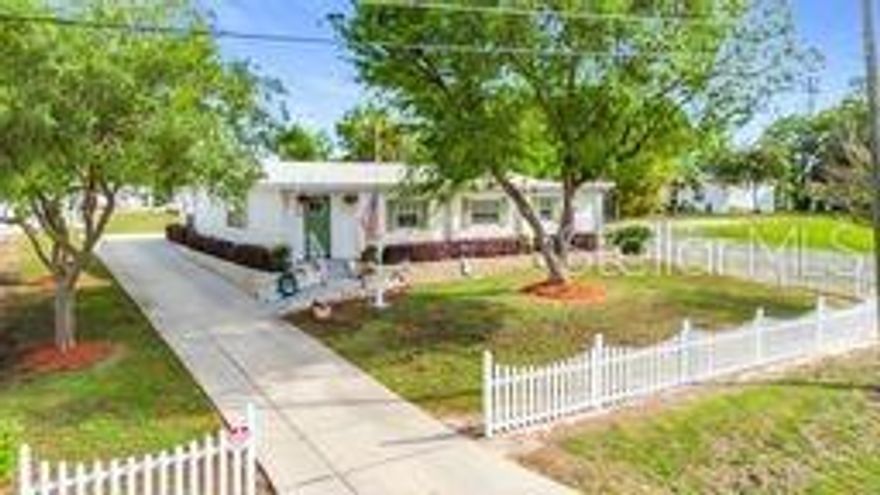 Rare multi-use 4 bedroom, 3.5 bath, 2091 sq ft compound on a spacious corner lot with NO HOA. Perfect for construction, lawn care, maintenance, or trade businesses with workshops, multiple sheds, dedicated business entrance, and a half bath inside the detached 2-car garage. Property includes RV parking with 50-amp hookup, 2-car carport, extended driveway, and room for trailers, boats, and equipment. 
Home features a private mother-in-law suite with separate entrance, split floor plan, sunken family room with wood-burning fireplace, LVP wood flooring, high ceilings, walk-in closets, walk-in pantry, and inside laundry Room. The kitchen offers wood cabinets, large stone-top island, and a formal dining area.Enjoy a fully equipped covered outdoor kitchen /BBQ area with grill, air fryer, sink, and refrigerator. Backyard is fully enclosed with vinyl privacy fencing set in concrete posts, plus full irrigation system, security lights, and cameras. Turnkey with lawn equipment included. A rare opportunity for buyers needing space for both personal living and entrepreneurial growth.