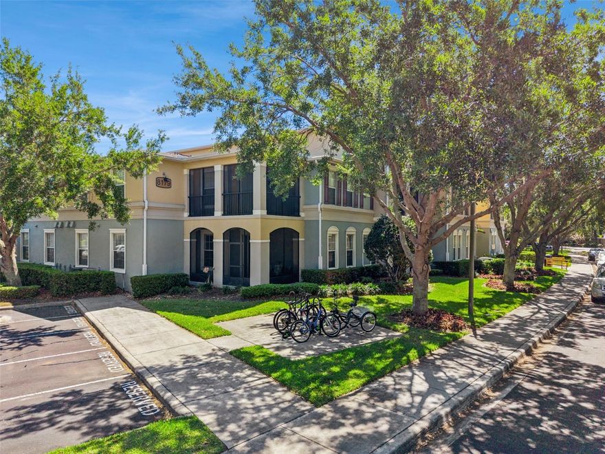 Located just 10 minutes from Disney's Magic Kingdom and Transportation and Ticket Center, welcome to this beautifully maintained FIRST FLOOR END UNIT in the highly sought after Lakeside at Lakes of Windermere. Move in ready and thoughtfully updated, this home offers a bright, open split floor plan with high ceilings and a light, neutral palette throughout. The home has been wired with high speed fiber optic internet, and association included valet trash, sewer, and water completes living with convenience. 

The kitchen has been tastefully upgraded with new FRIGIDAIRE GALLERY STAINLESS STEEL appliances, including a luxury INDUCTION RANGE, complemented by 42 inch wood cabinetry, a stainless steel backsplash, pantry, and bar seating that is perfect for everyday living or entertaining. The spacious owner’s suite is filled with natural light and offers a peaceful retreat, complete with a large walk in closet and an en suite bath featuring double sinks and a garden tub and shower combo. Secondary bedrooms are generously sized with one having an ensuite/shared bathroom, and the full size laundry closet adds everyday convenience. One of the standout features is the wraparound screened in porch where you can relax and enjoy the lush landscaping and mature oak trees, plus easy access to explore the beautifully maintained grounds or go fishing on Lake Burden. The amenities here truly stand out. Residents enjoy a resort style pool, tennis courts, fishing dock to LAKE BURDEN, clubhouse with full kitchen and gathering spaces, fitness center, beach volleyball court, outdoor fireplace, walking paths, playground, and more. With assigned parking, plus plenty of guest parking, and a prime location just across the street from Publix, dining options such as My French Cafe, Piesanos Stone Fired Pizza, Boteco do Manolo, and other great dining, shopping, top rated schools, and just minutes to Orlando’s world renowned theme parks, this is low maintenance living at its best.
