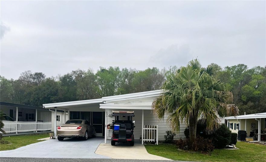 Welcome to this beautifully maintained 2-bedroom, 2-bath riverfront home in the premier 55+ waterfront community of Hawthorne at Leesburg. Perfectly positioned along the river, this home offers an open-concept floor plan filled with abundant natural light and stunning water views that create a bright and inviting atmosphere throughout.

The spacious kitchen is designed for both everyday living and entertaining, featuring elegant granite countertops, custom Amish-built cabinetry, and a large center island ideal for gathering with family and friends. Luxury vinyl plank flooring flows seamlessly throughout the home, adding durability and modern style. Both bathrooms feature walk-in showers for comfort and convenience, and the indoor laundry adds everyday practicality. The home is partially furnished, making it easy to move right in and start enjoying the waterfront lifestyle.

Step outside to the screened-in porch with collapsible doors—perfect for relaxing in the breeze or accommodating vehicle parking when needed. A riverside patio provides a peaceful setting to watch boats glide by, while a sidewalk wraps around the home for easy access to the water’s edge. For added peace of mind, the roof, HVAC system, and pest control are all maintained under long-term service contracts.

Beyond the home itself, Hawthorne at Leesburg is a vibrant 55+ community that blends comfort, convenience, and affordability. For just $397 a month, residents enjoy a maintenance-free lifestyle that includes water, sewer, lawn care, emergency services, and access to a wealth of resort-style amenities—plus secure RV and boat storage.

The expansive clubhouse serves as the social hub of the community, offering over 100 organized activities, a welcoming lounge, card rooms, billiards, a fitness center, a library, and a fine arts studio. A dedicated program coordinator ensures there’s always something fun and engaging on the calendar. For boating enthusiasts, the private marina features more than 120 boat slips with direct access to the beautiful Harris Chain of Lakes.

Safety and peace of mind come standard with a 24/7 on-site team of state-certified firefighter/EMTs, emergency vehicles, and in-home emergency response buttons. Surrounded by natural beauty, the community offers scenic walking trails, serene lake views, and countless opportunities for fishing and boating. Golf cart-friendly streets make it easy to explore nearby shopping, dining, and medical facilities.

With a sparkling pool, endless recreational options, and a warm, welcoming atmosphere, Hawthorne at Leesburg isn’t just a place to live—it’s a lifestyle.

Schedule your private showing today and discover the perfect blend of waterfront living, comfort, and community.