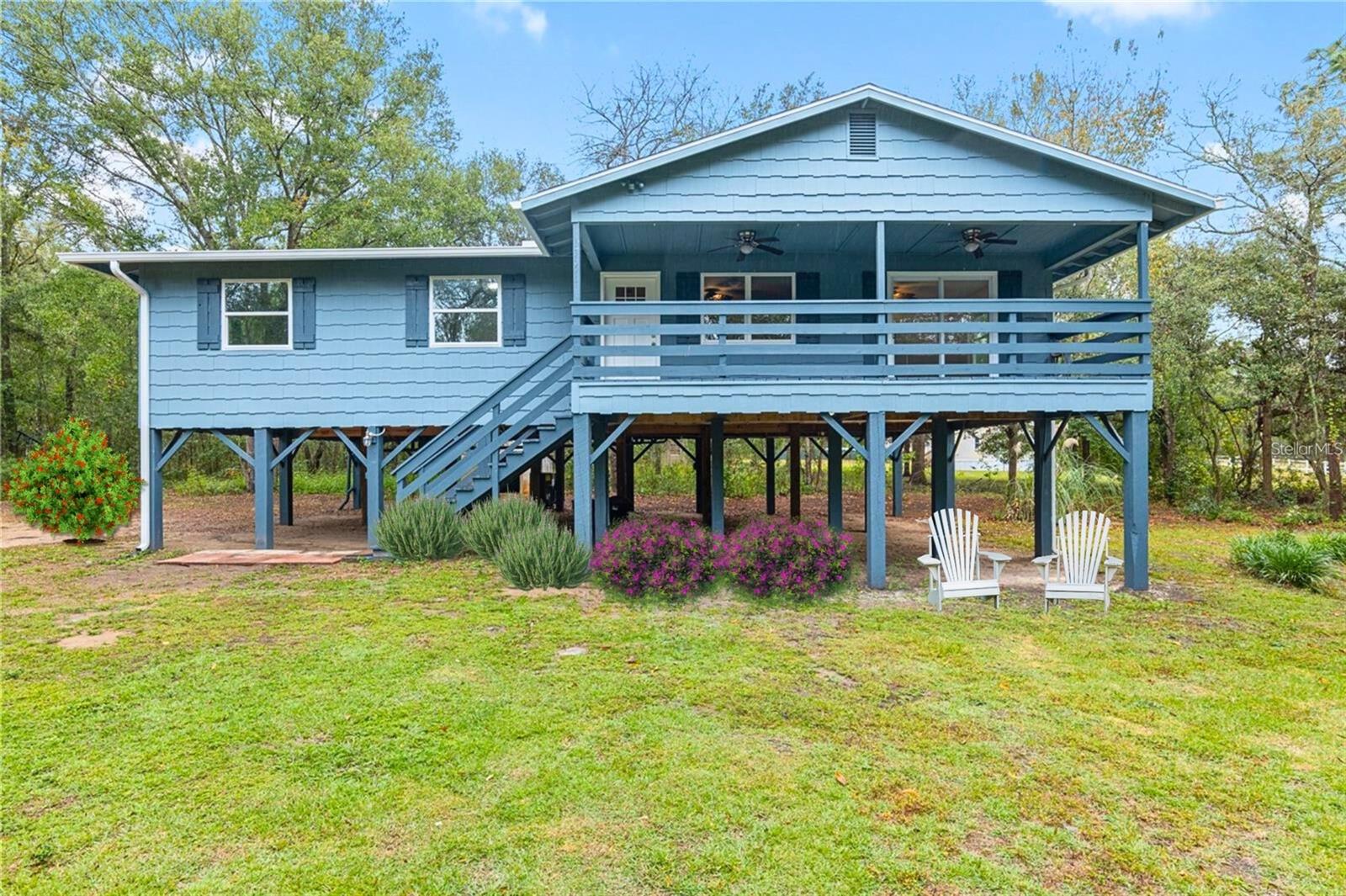 One or more photo(s) has been virtually staged. Fully renovated (Nov 2023) 3-bedroom, 2-bathroom home nestled on a 1-acre lot in the charming town of Williston, FL. This move-in-ready home blends modern updates with comfortable rural living.
Set back on a quiet dirt road, the elevated home sits proudly on stilts, offering a unique architectural style along with a spacious covered parking area and generous storage underneath. The entire property has been thoughtfully updated, including a newer roof, gutters with leaf guards, and energy-efficient low-e tilt-in vinyl windows.
Inside, the open layout features new luxury vinyl plank flooring throughout and a light, airy ambiance enhanced by natural light. The kitchen has been completely reimagined with granite countertops, appliances, and a large sink that overlooks the lush backyard—perfect for everyday living and entertaining.
The private primary suite includes a walk-in closet and a fully updated bathroom with stylish finishes. Both bathrooms have been modernized to provide a clean, spa-like feel. Enjoy the outdoors from your covered deck, relax around the firepit, or take advantage of the oversized shed for extra storage or workspace.
This beautifully upgraded home offers the best of peaceful country living with all the benefits of a modern renovation. Don’t miss your chance to own this one-of-a-kind property in Williston—ready for you to move in and enjoy.