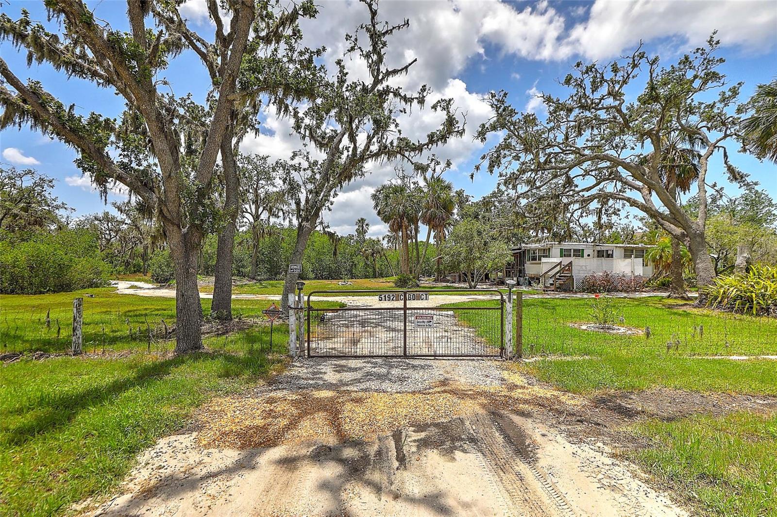 Nestled alongside the picturesque Manatee River, this remarkable 7.6-acre real estate property presents an exceptional possibility for investors seeking a waterfront haven or development opportunity in Manatee County in Bradenton, Florida. Conveniently located near I-75, this expansive land boasts impressive features, including a 280-ft artisan well, a septic system, and a private boat dock ready for all your aquatic toys or just a quiet place to fish. The property is also close to Tom Bennett Park which has plenty of activities for all ages. This property is also an easy distance from shopping, schools, dining, golfing and just a 15 mile drive to the beautiful pristine beaches of Anna Maria Island. Do not miss out on this rare opportunity to own this extremely versatile piece of waterfront paradise. Schedule your showing today!