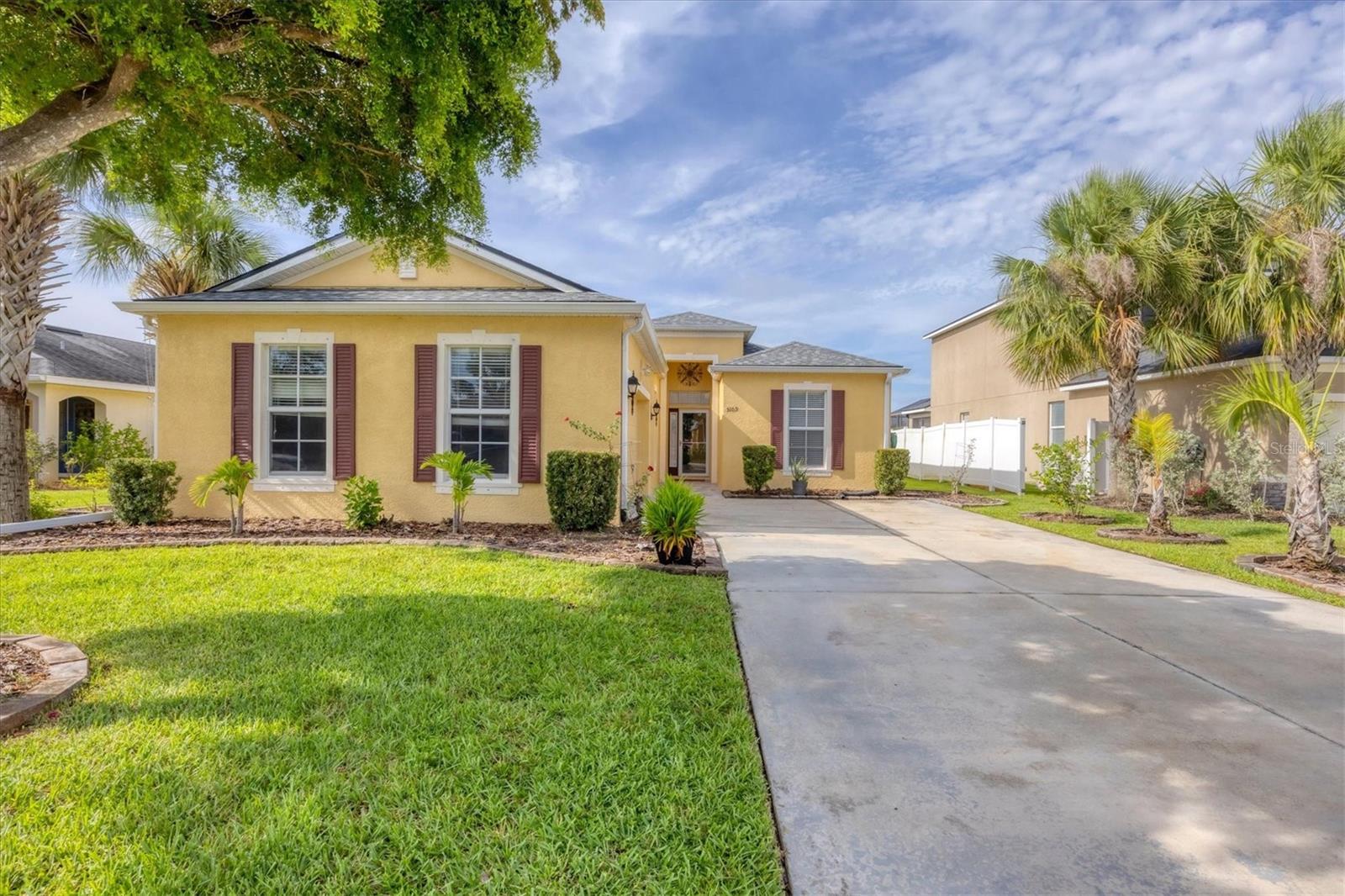 Available immediately as an annual rental, this waterfront home in Crystal Lakes offers peaceful views, a well-designed layout, and an open concept perfect for everyday living and entertaining! The home welcomes you into a spacious living area with high ceilings, recessed lighting, and beautiful sightlines straight out to the water. Off to the side, a flexible front room with a tray ceiling functions well as a formal dining room or bonus area, and connects to the kitchen through a wide passthrough. The kitchen is outfitted with stainless steel appliances, ample cabinetry, generous counter space, and a raised bar that opens into a bright dinette surrounded by windows. Each of the three bedrooms is positioned in a separate corner of the home for privacy. One is located near a full hall bath, and another includes its own private en suite. The primary suite sits at the rear of the home with a tray ceiling, two closets, and a large bathroom featuring dual vanities and a soaking tub. Sliding glass doors at the rear of the home open to a screened lanai with serene views of the pond—an ideal spot to unwind, dine outside, or simply enjoy the peaceful setting. Crystal Lakes offers a community playground, basketball court, and convenient access to I-75, US-41, and a variety of shopping and dining options nearby. Schedule your private showing today!