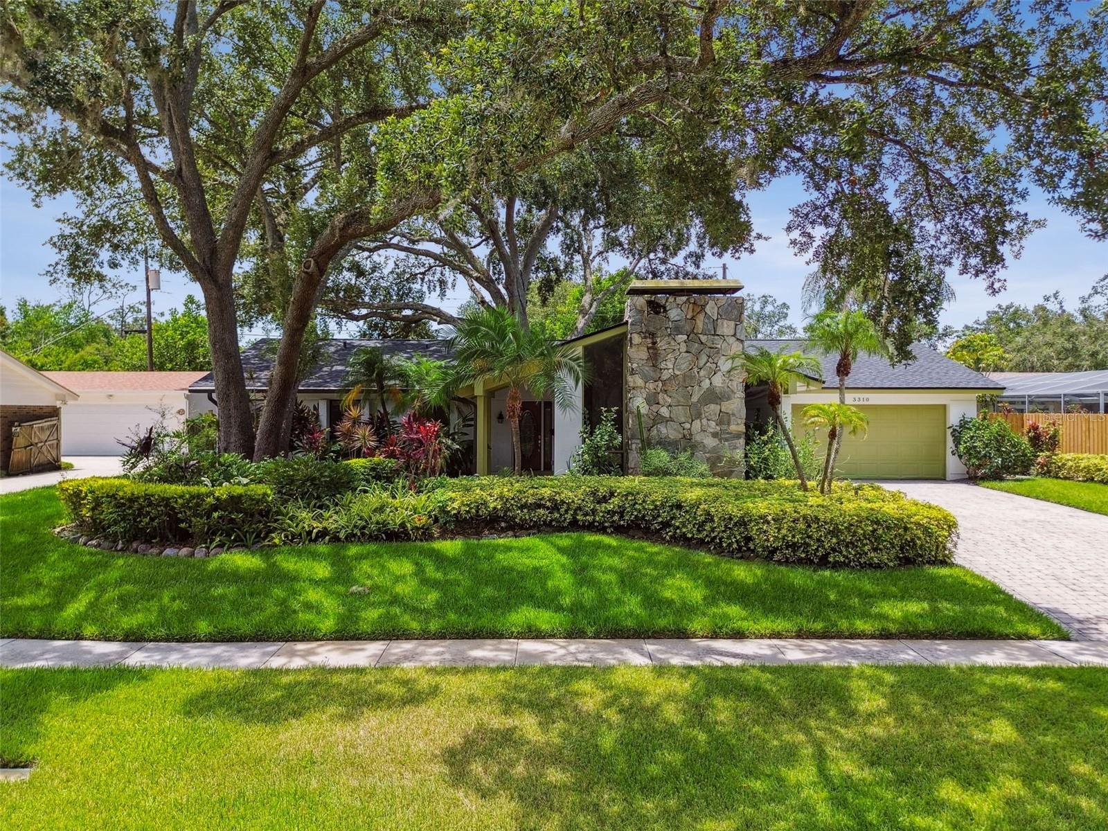 This beautiful home located on 1/4 acre of land in Original Carrollwood has lush landscaping, a backyard that is fully fenced on all sides, driveway with pavers, cordless sunshades on bedroom windows, large laundry room with updated cabinets, lots of closet/storage space, and a spacious layout with 4 bedrooms, 2 full baths, & 2 car garage. Relax after a long day or enjoy dining alfresco on your covered & screened lanai overlooking the pond and lush back yard. Kitchen boasts Corian counters with an integrated/seamless sink, tile backsplash, smooth top range, and large closet pantry. The breakfast bar overlooks the dinette & spacious family room with sliding glass doors leading to the lanai, letting in loads of natural light. The formal dining room is located off the kitchen and the formal living room can be used as a seating area, office, media/game room, or playroom…the options are endless! The primary suite has lots of closet space, room for a king size bed, and an attached master bath with a large vanity with Corian counters and dual integrated/seamless sinks, and a walk-in shower. The secondary bedrooms are spacious & the secondary bath has access from the hallway as well as the 4th bedroom. There is a coat closet near the front door for additional storage and the laundry room is located off the dinette that has room for a side-by-side washer & dryer and lots of cabinet & counter space. Some of the many updates include: New waterproof laminate flooring 2025, fresh interior paint 2025, updated interior lighting 2025, New Roof 2022, Water Heater 2020, AC 2016, New Fridge Nov 2024. House had a fire in 2005 and the majority of the house was re-built 2005-2006. Enjoy everything Original Carrollwood has to offer: tennis courts, pickleball, playgrounds, parks, picnic areas, dog park, baseball & soccer fields, rec center, & private beach on Lake Carroll- a 210-acre lake with access for boating, kayaking, paddle boarding, fishing, swimming & more! Plus, the $800/year HOA fees are included in tax bill. Enjoy Florida living at its finest!