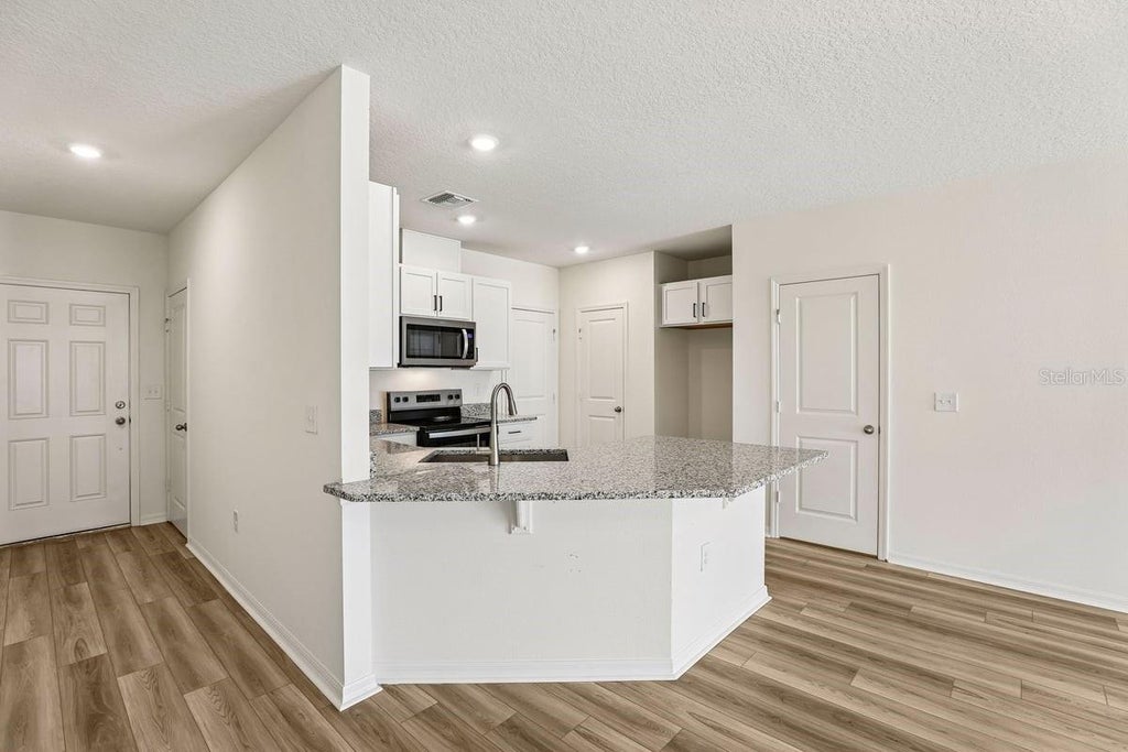 Photo of 643 Meadows Edge Place, Lake Wales, FL 33859 (MLS # O6443302)