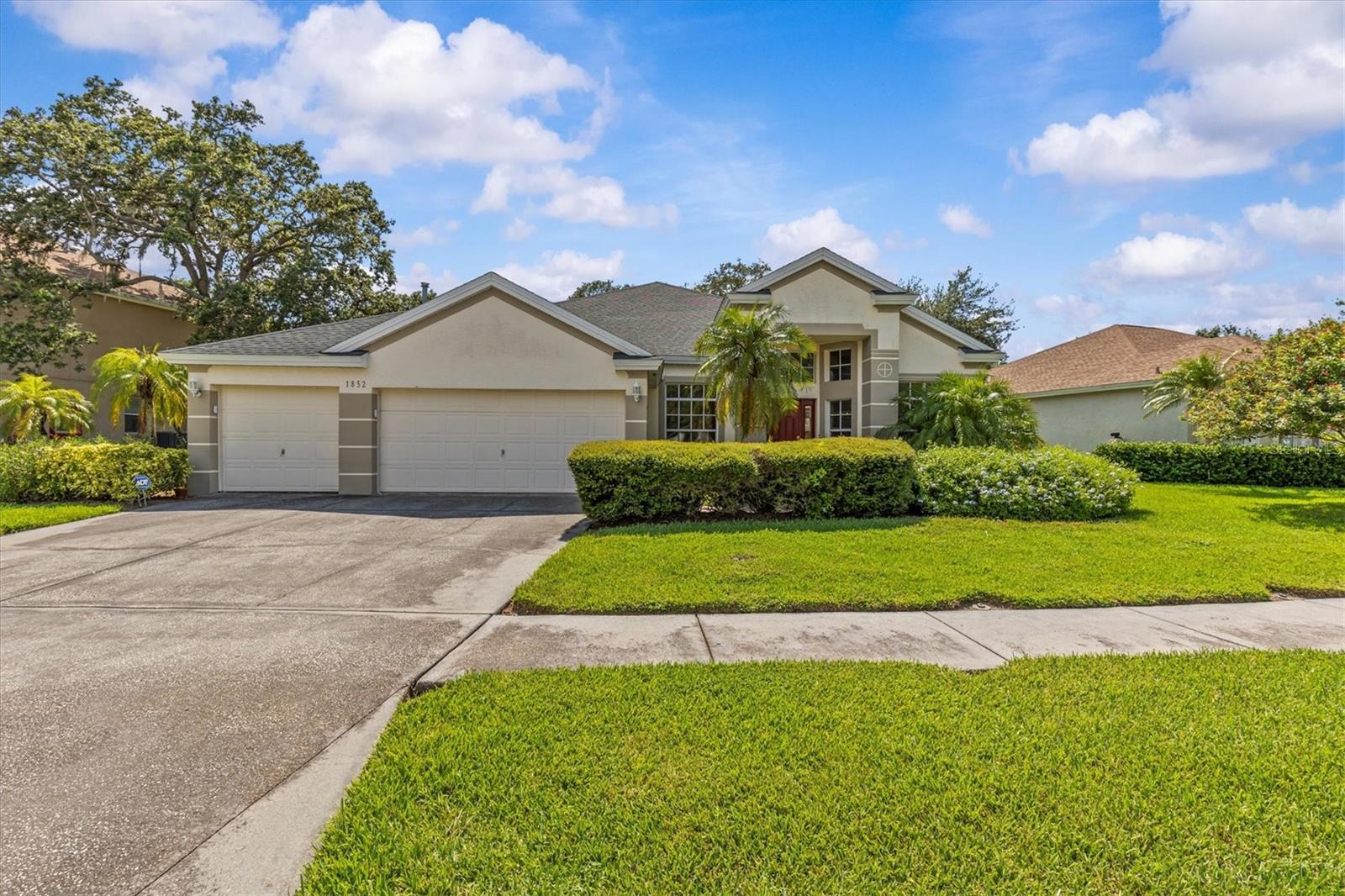 Welcome to this beautifully maintained 4-bedroom, 2.5-bath home, offering a thoughtfully designed layout and serene conservation views. As you step inside, you're greeted by an abundance of natural light streaming through large windows that frame the tranquil backyard setting.
The formal living and dining areas create an inviting space for entertaining, while a versatile room to the left can serve as a fourth bedroom or home office. The spacious family room features soaring ceilings, ideal for both relaxation and gatherings.
The kitchen is a chef’s dream, complete with a cozy eat-in nook, a generous pantry, and extensive counter space. Just off the kitchen, step out onto your expansive lanai—perfect for unwinding and enjoying peaceful outdoor living.
The private primary suite offers a unique entryway, enhancing the sense of retreat. Its en-suite bath includes a large walk-in closet, dual vanities, a garden tub, separate walk-in shower, and a private water closet. Two additional bedrooms are connected by a convenient Jack and Jill bathroom, perfect for family or guests.
Additional features include a laundry room located inside the home, a three-car garage, and gas connections for the water heater (2023), dryer, and fireplace. The HVAC was replaced in 2020, and the roof in 2018.
This home offers comfort and peace of mind with low HOA fees and a no-flooding history. Located just minutes from two Gulf Coast beaches, scenic parks, the historic Tarpon Springs Sponge Docks, shopping, dining, golf courses, the Pinellas Trail, and Craig Park with lighted tennis courts and a boat/kayak launch.
Nearby amenities include top-rated schools, medical facilities, St. Petersburg College (Tarpon Springs Campus), and the Jacobson Culinary Arts Academy. Tampa International Airport is a convenient 35-minute drive away.