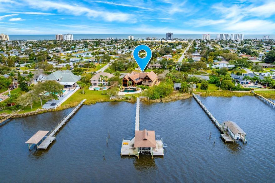 Updated Intracoastal WATERFRONT estate on double lot! Rare opportunity to own an exclusive Strasser owned & built custom home. Experience ultimate luxury with BRAND NEW KITCHEN, expanded to accommodate today's needs. Salt pool received extensive RENOVATION including resurfacing, new tiles, new equipment & new heater. New interior paint & herringbone wood plank tile floors in 2024. Home is laid out perfectly for expansive intracoastal views from all living space. Meticulous attention to detail & unmatched quality. Master bedroom downstairs with morning bar, fireplace & two large walk in closets. Ensuite/junior master bedroom downstairs. Downstairs IN LAW SUITE w/ private entrance, kitchen living area & pool access. Office downstairs with custom built in wood work, with private entrance.