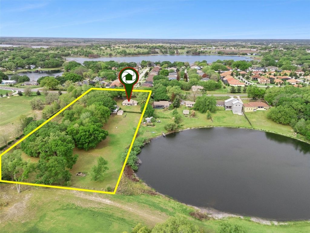 Photo of 10010 Lakeshore Drive, Clermont, FL 34711 (MLS # O6391119)