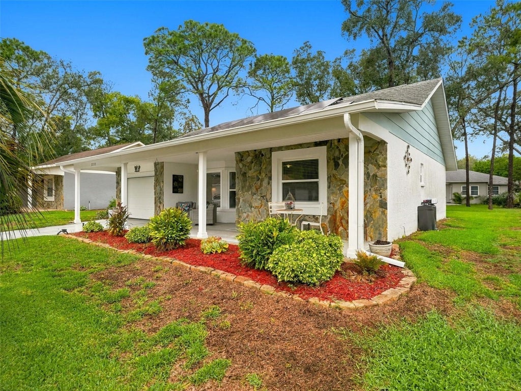 Photo of 2277 Pebble Beach Drive, Spring Hill, FL 34606 (MLS # W7890181)