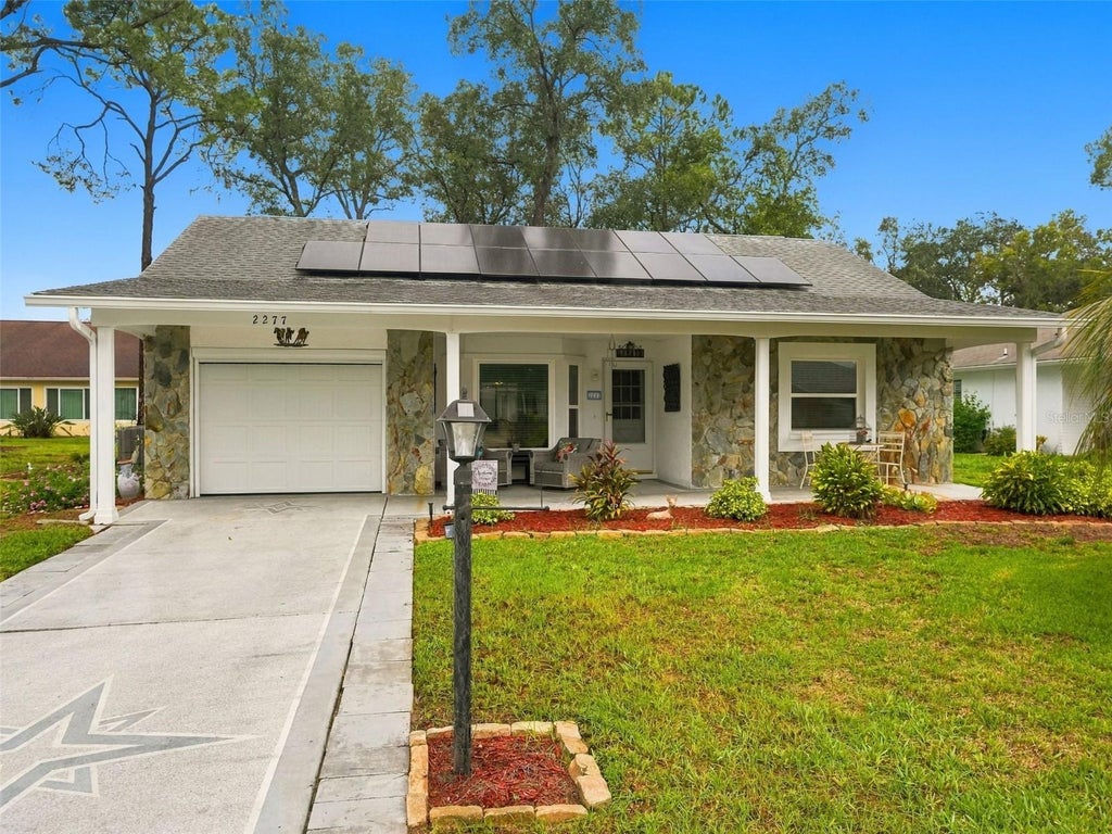 Photo of 2277 Pebble Beach Drive, Spring Hill, FL 34606 (MLS # W7890181)