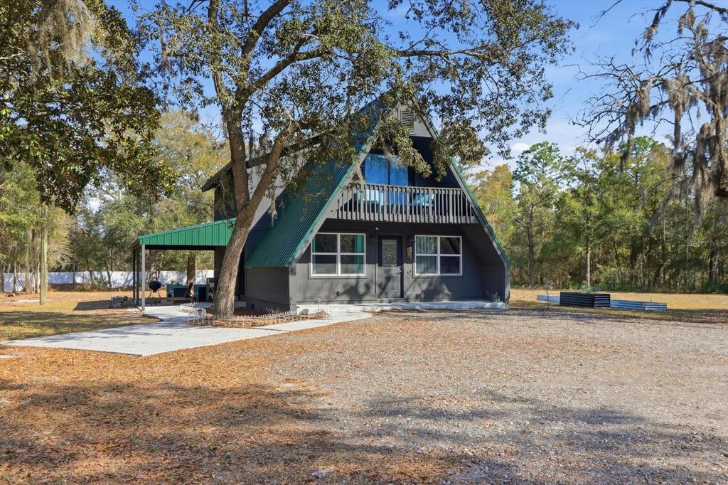 Photo of 12142 Boondocks Drive, Brooksville, FL 34614 (MLS # TB8474845)