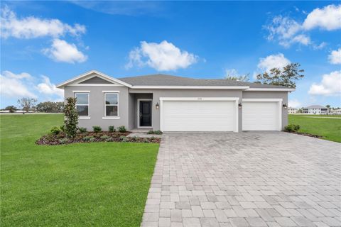 Photo of 1332 Dunblane Way NE, Palm Bay, FL 32905 (MLS # O6379930)