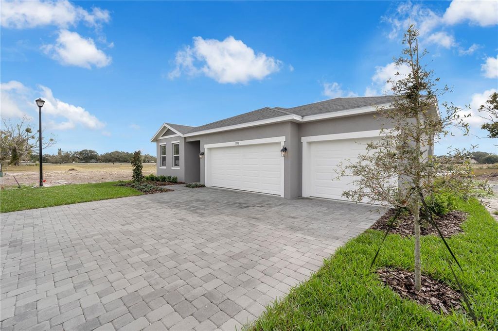 Photo of 1332 Dunblane Way NE, Palm Bay, FL 32905 (MLS # O6379930)