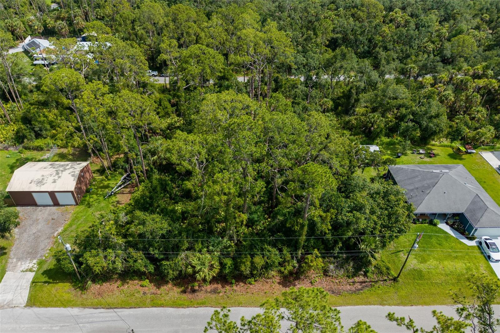 Embrace the opportunity to create your ideal residence on this spacious 0.23-acre lot located at Lot 19 Hackley Road in the Port Charlotte Subdivision of North Port. With ample room for a pool and situated in a peaceful neighborhood, this property offers the perfect setting for your new home.
Property Highlights:
Lot Size: 0.23 acres (approximately 10,000 sq ft)
Dimensions: 80' x 125'
Zoning: RSF2
Utilities: Electricity available; well and septic required
Flood Zone: X (low risk)
Road Access: Paved street frontage
HOA/Deed Restrictions: None
Location Benefits:
Situated in a serene residential area, this lot offers easy access to major roadways and is just a short drive from various amenities:
Beaches & Boating: Approximately 25 minutes to the beautiful beaches of Manasota Key in Englewood
Shopping & Dining: Close proximity to Cocoplum Village Shops and Port Charlotte Town Center mall
Sports & Recreation: Nearby CoolToday Park (Atlanta Braves Spring Training) and Charlotte Sports Park (Tampa Bay Rays Spring Training)
Golf Courses: Multiple public golf courses in the area
Historic District: A short drive to historic Dearborn Street in Englewood, featuring art galleries, antique shops, and a Farmer's Market
Educational Institutions:
Elementary: Lamarque Elementary School (Grades PK-5)
Middle School: Heron Creek Middle School (Grades 6-8)
High School: North Port High School (Grades 9-12)