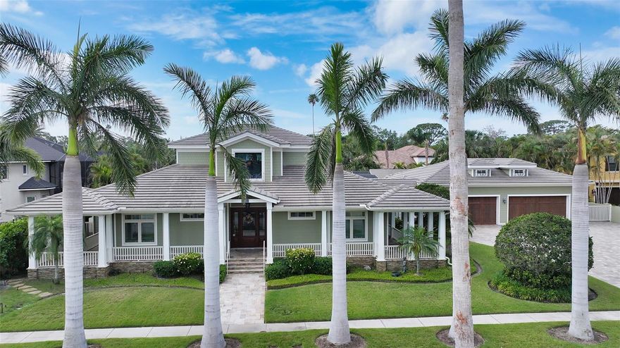 West of Trail! Custom Build by Voight Construction. Nestled in one of Sarasota’s most coveted neighborhoods, this exceptional custom estate spans over three expansive lots and boasts craftsmanship that is truly one-of-a-kind. A celebration of fine design, this home features intricate millwork, rich stained oak floors, and soaring ceilings adorned with stunning pecky cypress inlays.

Step inside to discover a warm and inviting chef’s kitchen with handcrafted cabinetry, luxurious stone countertops, and character-filled details throughout. The open floor plan flows effortlessly into elegant living and dining spaces, all surrounded by oversized windows and French doors that invite the outdoors in.

Enjoy the Florida lifestyle year-round on the charming wraparound porch, by the private pool, or grilling in the fully equipped outdoor kitchen. A spacious guest house provides the perfect retreat for visitors, while the rare 6-car garage is a dream for car enthusiasts or collectors.

Located west of the trail, just minutes from downtown Sarasota, this estate offers unmatched privacy, artistry, and convenience — a true architectural gem rarely found in today’s market.