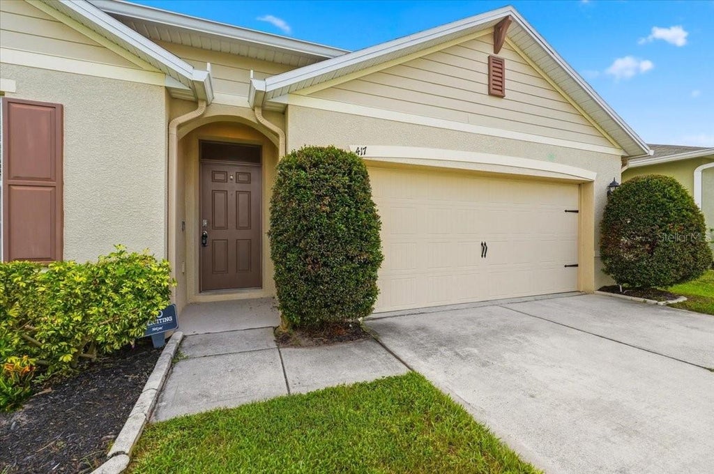Photo of 417 Corso Loop, Winter Haven, FL 33884 (MLS # O6425451)