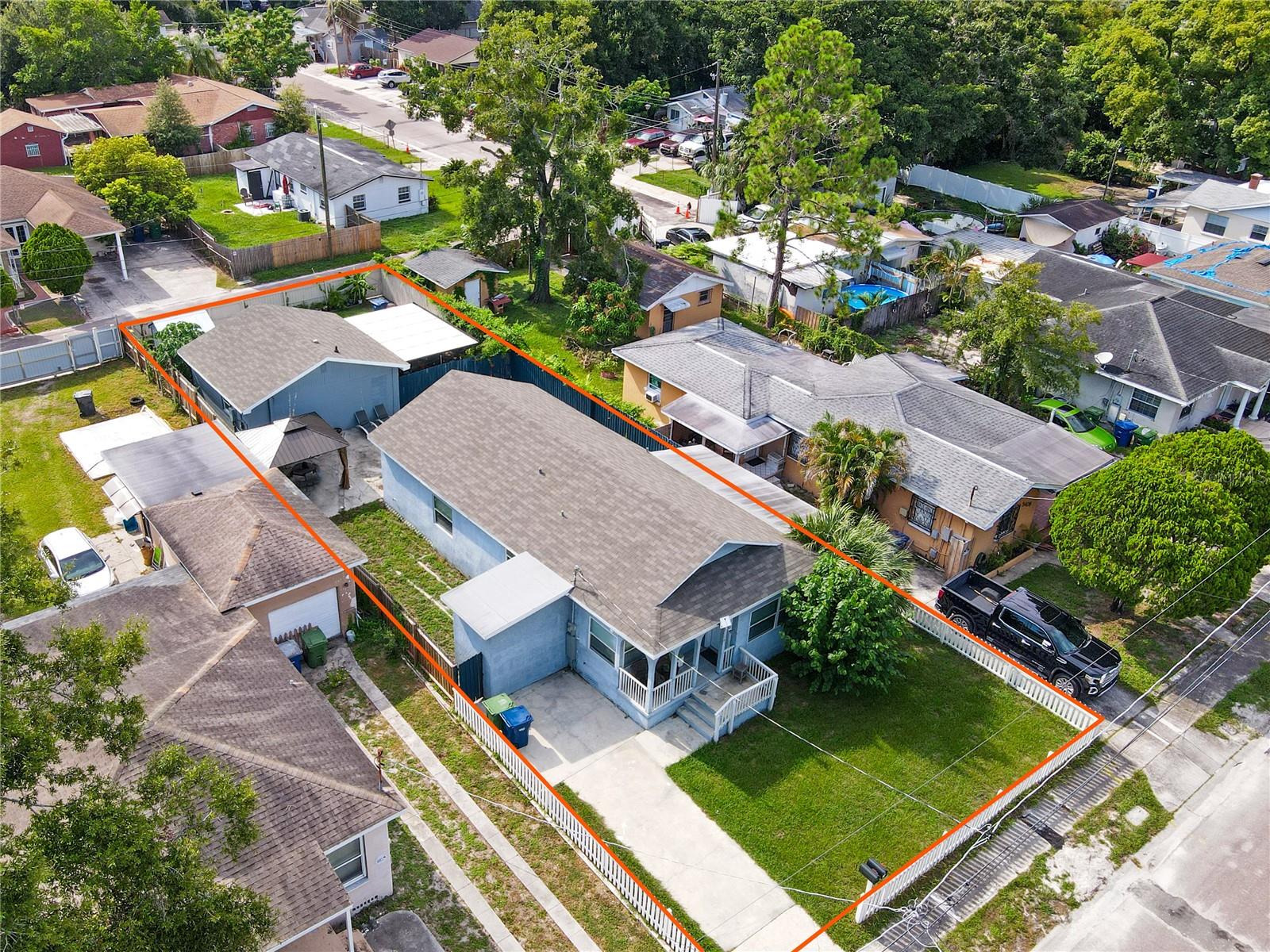 ***REBUILT & FULLY REMODELED BETWEEN 2020 AND 2023 – 2 HOMES ON 1 LOT in the EARTH OF YBOR!***
This Mediterranean-style property in YBOR offers two separate homes on one lot, blending HISTORIC CHARACTER with EXTENSIVE MODERN UPDATES.
In 2020, the majority of the MAIN RESIDENCE was DEMOLISHED AND REBUILT with completion in 2022—including NEW FOUNDATION, ROOF, PLUMBING, ELECTRICAL, HVAC, WALLS—while preserving the front porch, original footprint, and architectural charm.
Inside, the FIRST HOME features 3 BEDROOMS, 2 BATHROOMS, plus a spacious BONUS/FLEX ROOM. The layout flows beautifully: an entry porch opens to a large great room, then connects to a cozy, well-appointed kitchen with GRANITE COUNTERTOPS, STAINLESS-STEEL APPLIANCES, and White Shaker Cabinetry. A laundry room sits conveniently off the kitchen. The primary suite boasts a large closet and a new ensuite bath, while the two additional bedrooms (one with large walk-in closet) share another NEWER BATHROOM with GRANITE COUNTERTOPS. The BONUS ROOM located on a Split Level with charming wrought-iron railing, offers flexible space for a home office, gym, or playroom. Outdoors, the rear courtyard with a BRAND-NEW GAZEBO provides the perfect setting for relaxing or entertaining.
The SECOND HOME, remodeled in 2023 with a NEWER ROOF from 2020, has its own REAR-STREET ACCESS (Devon St) with pedestrian and car gates. Inside, it offers 1 BEDROOM, 1 OFFICE, 1 BATHROOM, and an OPEN LIVING/KITCHEN layout. VAULTED CEILING with EXPOSED BEAMS create a modern rustic feel, while the LARGE SCREENED-IN LANAI extends living space for indoor-outdoor enjoyment. A PRIVATE SHED and manicured landscaping complete this charming and cozy Home.
***PRIME LOCATION***: Minutes from Historic Ybor City, Downtown Tampa, Waterworks Park, Curtis Hixon Park, and the Port of Tampa. Ybor is no longer “up-and-coming”—it’s thriving. The area is undergoing major transformation, including a 15,000-seat professional women’s soccer stadium and the 33-acre Ybor Harbor redevelopment—connecting Ybor directly to downtown via the TECO Streetcar and Tampa Riverwalk.
This versatile dual-home property offers a great a stable and already established investment opportunity. Schedule your private showing today!