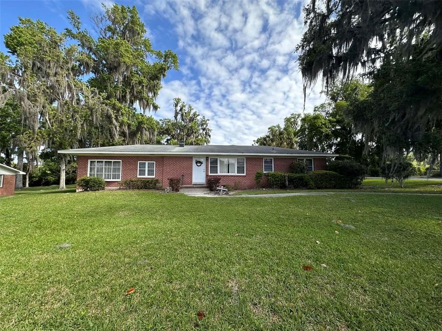 Welcome to this charming 3 bedroom, 2 bath home featuring a flexible office space and a generous family room right off the kitchen, ideal for everyday living and entertaining.  The open living and dining room combination creates a welcoming flow, while the enclosed porch offers a relaxing view of the lovely backyard.  Step outside easily from either the family room or the primary bedroom and enjoy your private outdoor retreat.  Seller has applied to have home to zoned RO and this home would also be easily transformed into office space.