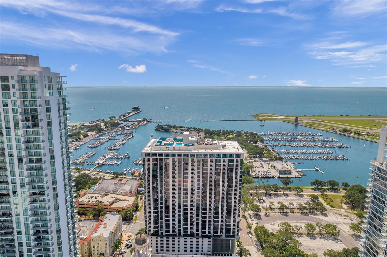 The BEST FULL WATER VIEWS in Downtown St Pete, UNFURNISHED beautiful condo for rent with all amenities, minimum 12m lease required. Stunning FULL water views of Tampa Bay, new Pier, airport, museum and more! New triple pane high impact rated windows keeps the Florida heat and sunrays out. Updated LVP flooring, HVAC, vanity, shower, flooring, paint, appliances, washer & dryer. Enjoy all the amenities Bayfront Tower has to offer, rooftop pool overseeing Downtown and the water. Fitness center, kitchenettes, game room, business center, library, 24 hour concierge with valet. Very large airconditioned storage on your floor, and one covered and secured parking space, where you can even valet your car!! Come see, won't last!