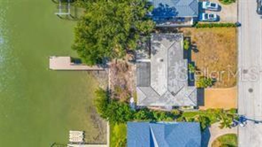 WATERFRONT REDEVELOPMENT opportunity in St. PETE'S CAUSEWAY ISLES! 
The existing home is uninhabitable after Hurricane Helene, making this a clear teardown. The homesite offers 75 feet of direct waterfrontage, a newer composite dock, and a solid concrete seawall just off the Intracoastal. With southern rear exposure for sunrise and sunset views, and quick Gulf access with no fixed bridges, it’s an ideal setting for a new custom build. The existing 3-bedroom, 2-bath, 1,631 sq. ft. home is uninhabitable after Hurricane Helene, making this a clear teardown opportunity ready for your dream project with strong investment potential. Located near Treasure Island beaches and downtown St. Petersburg’s dining, marinas, golf, the Dali, St. Pete Pier, IndyCar GP, soccer, private airport, and more. A rare chance in a prime location!