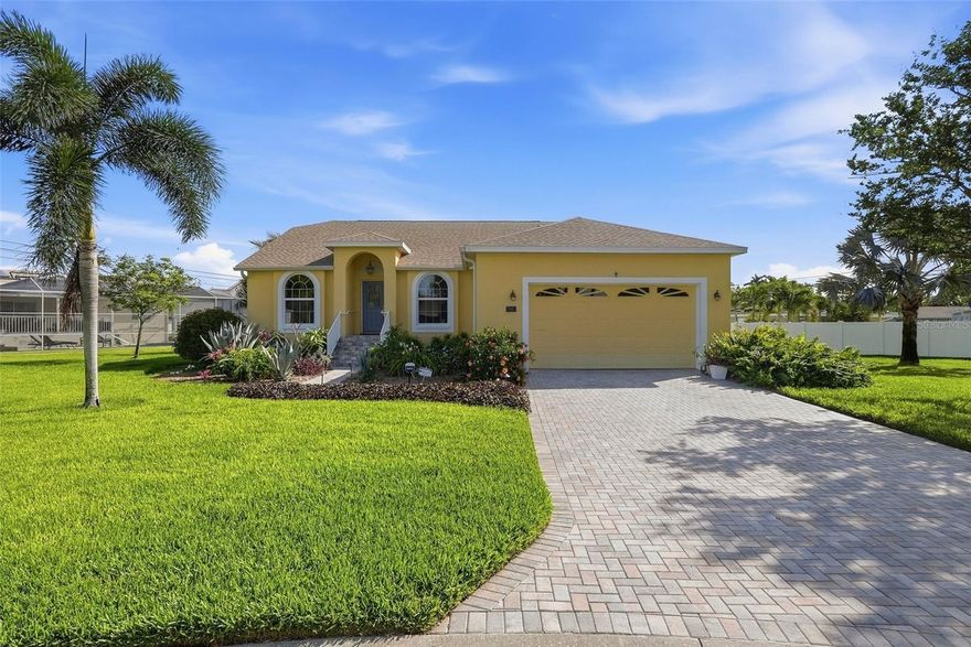 A rare opportunity in desirable Maximo Moorings, this newer build 3 bedroom pool home sits on a quiet cul de sac and delivers the perfect blend of modern updates, thoughtful design, and effortless Florida living. Every detail has been beautifully refreshed, and the home’s open layout—with soaring cathedral ceilings and luxury vinyl flooring—creates a bright, inviting atmosphere from the moment you step inside. At the heart of the home is a chef inspired kitchen featuring Quartzite counters, custom cabinetry, natural gas cooking, a center island with wine refrigerator, and a convenient pot filler above the stovetop. The split bedroom floor plan offers exceptional privacy, with a spacious primary suite that includes a large walk in closet and an updated bath with custom vanity, granite, soaking tub, and separate shower. A flexible bonus room off the primary—complete with closet and sliding doors to the patio—makes an ideal office, gym, or even a 4th bedroom. Both guest bedrooms feature vaulted ceilings and generous closet space. The light filled family room, enhanced by a skylight, flows seamlessly to the outdoor living area where a sparkling pool, covered patio, and full pool bath create the perfect setting for entertaining or relaxing. Set on over a quarter acre, this home offers an impressive list of upgrades: impact windows and doors, whole house generator, tankless water heater, interior laundry with sink, plantation shutters, all new pool equipment, epoxy finished 2 car garage, and a pavered driveway. Maximo Moorings is one of St. Petersburg’s most convenient waterfront communities, offering quick access to I 275, the Pinellas Bike Trail, Maximo Marina, restaurants, and shopping. You’re just 5 minutes to St. Pete Beach and 15 minutes to downtown St. Pete with its museums, dining, and vibrant waterfront. This beautifully updated home checks every box—space, style, upgrades, and location. Homes like this don’t come along often. Come experience it today.